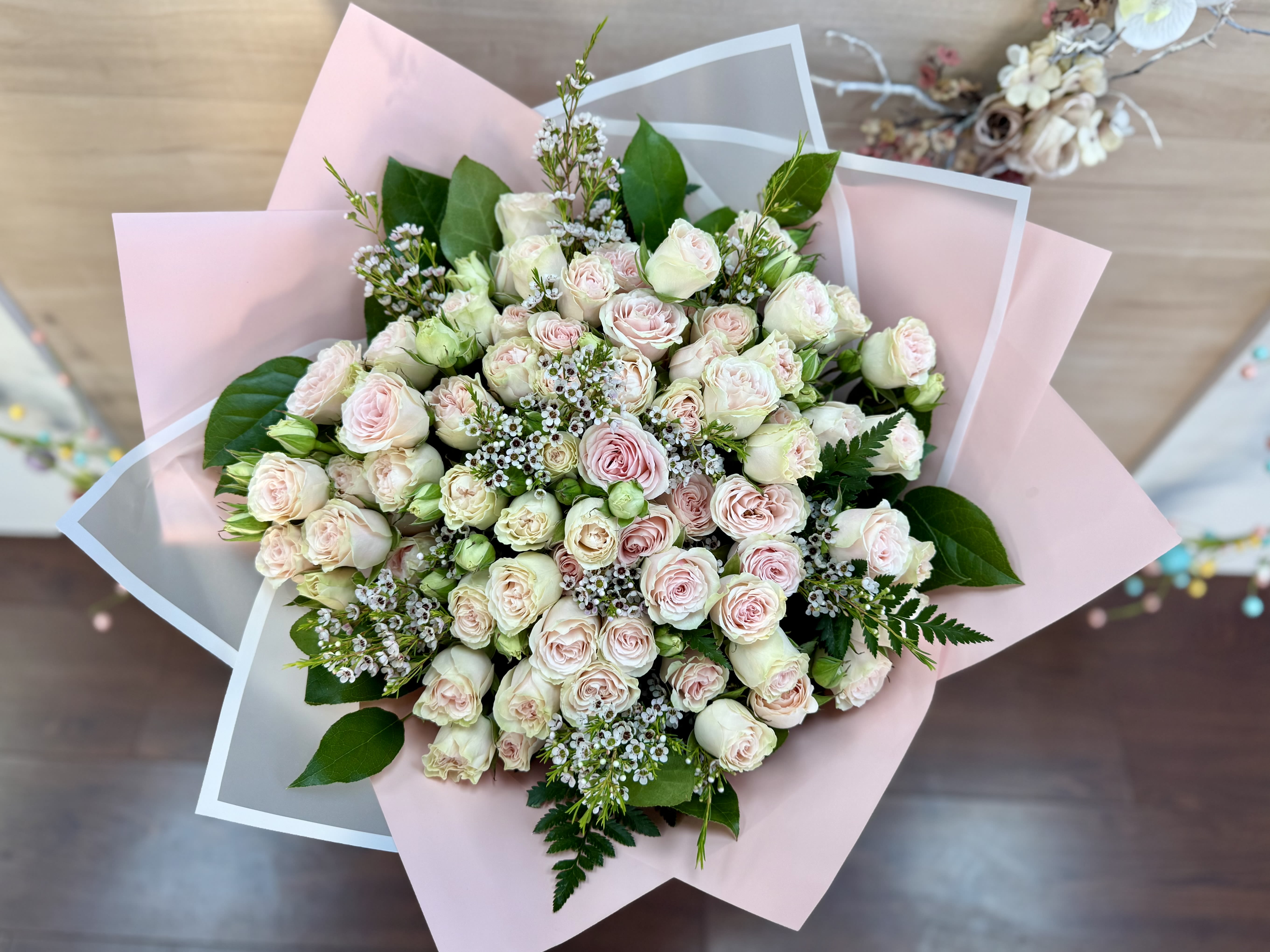 Sunshine - An elegant floral arrangement featuring a blend of pure white and vibrant blooms. Perfectly balanced in color and style, it brings freshness, beauty, and a touch of sophistication to any occasion.