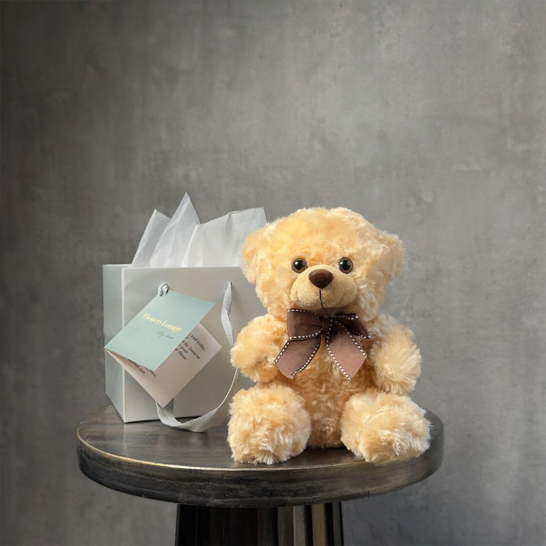 Brown Cuddle - A soft and adorable brown teddy bear, perfect for adding warmth and charm to any flower delivery. A lovely companion for romantic gifts, birthdays, or special surprises. Custom greeting card included.