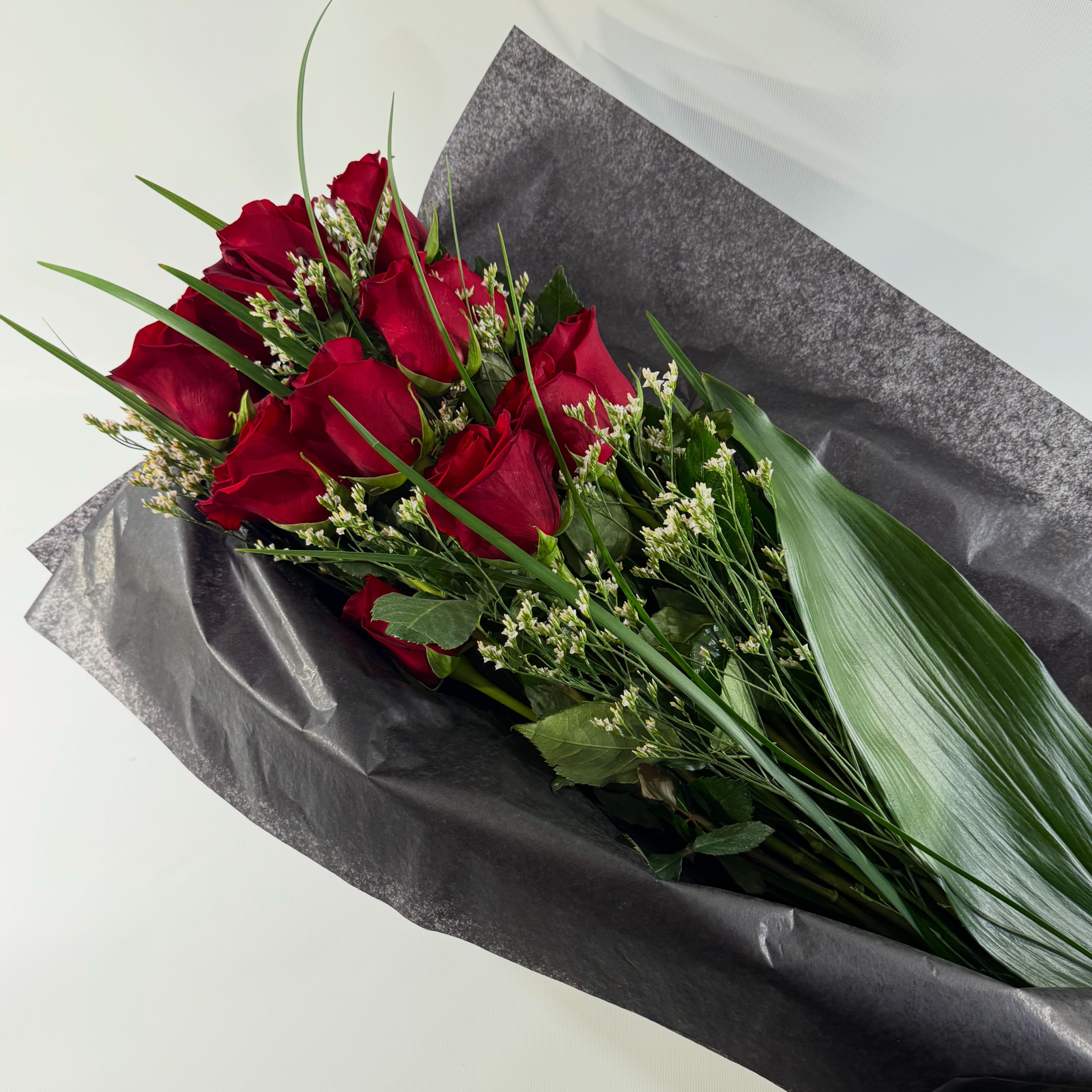 ADORATION - Dozen boxed roses - Surprise someone special with a bouquet of roses which they can arrange in their own vase. *also available in white, pink, or yellow. Please specify color change in the special instructions. 