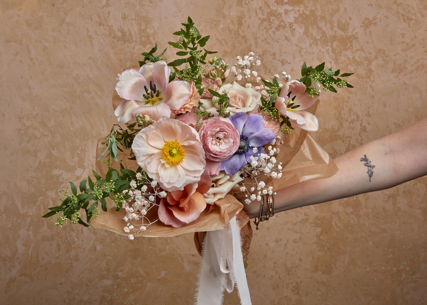 Designers Choice Fresh Floral Bundle - Brighten someone's day with a bundle of fresh blooms, foliage, and wildflowers sweetly wrapped with a cascading bow!  Flowers vary based on season and availability, but we will select the freshest, most beautiful seasonal blooms for your wrap.  Want Wild Dahlia flowers on the reg? We have flower subscriptions available for Easton area delivery or in-store pickup.  Have a special request? Let us know in the special requests section of your order during checkout.  