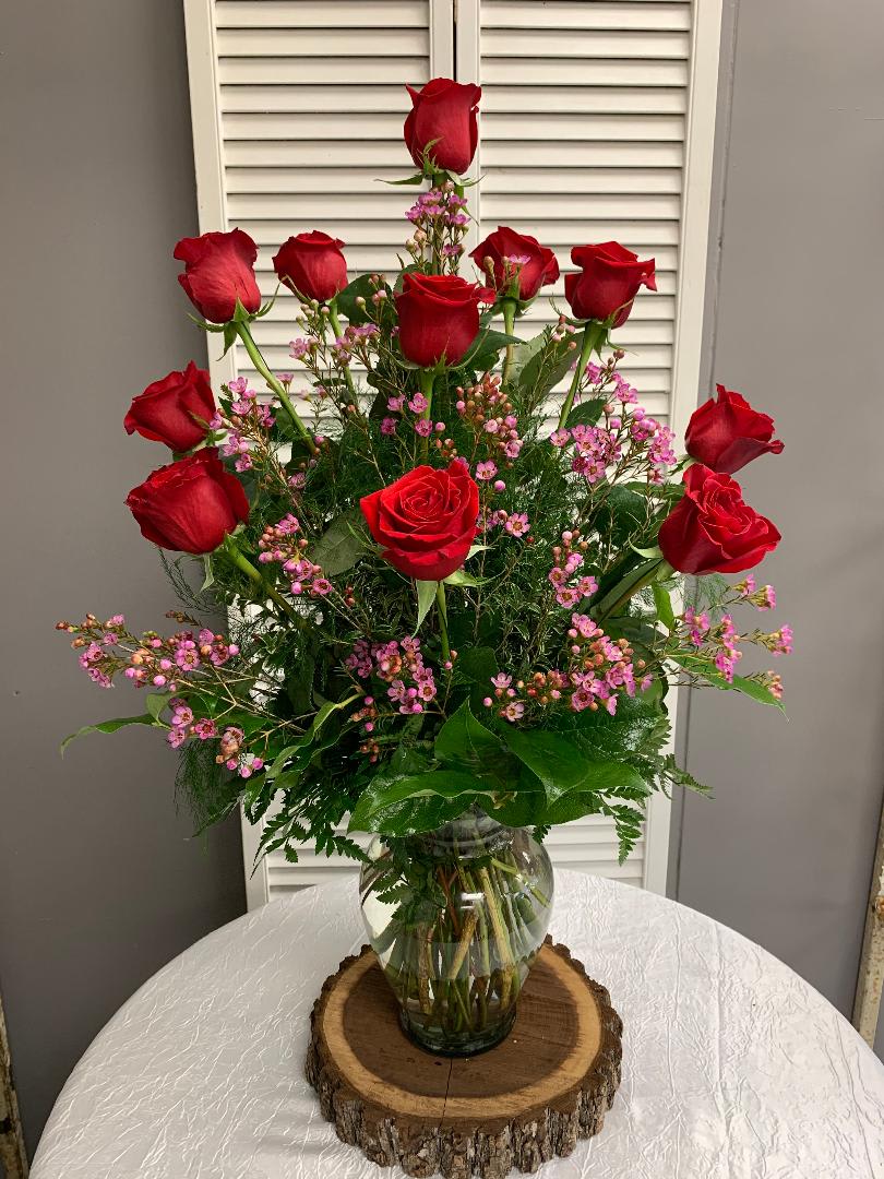 Dazziling Dozen Rose Arrangement with Filler Flowers - The classic and timeless vase of a dozen red roses you know she'll love.  Filler flower may vary. Other color roses are available - please specify when ordering.