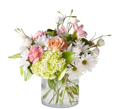 Flutter By Bouquet - The textured florals and soft shades in this lush arrangement are bound to make any day brighter. Designed by an artisan florist, this bouquet shares both charm and grace with those you cherish most.