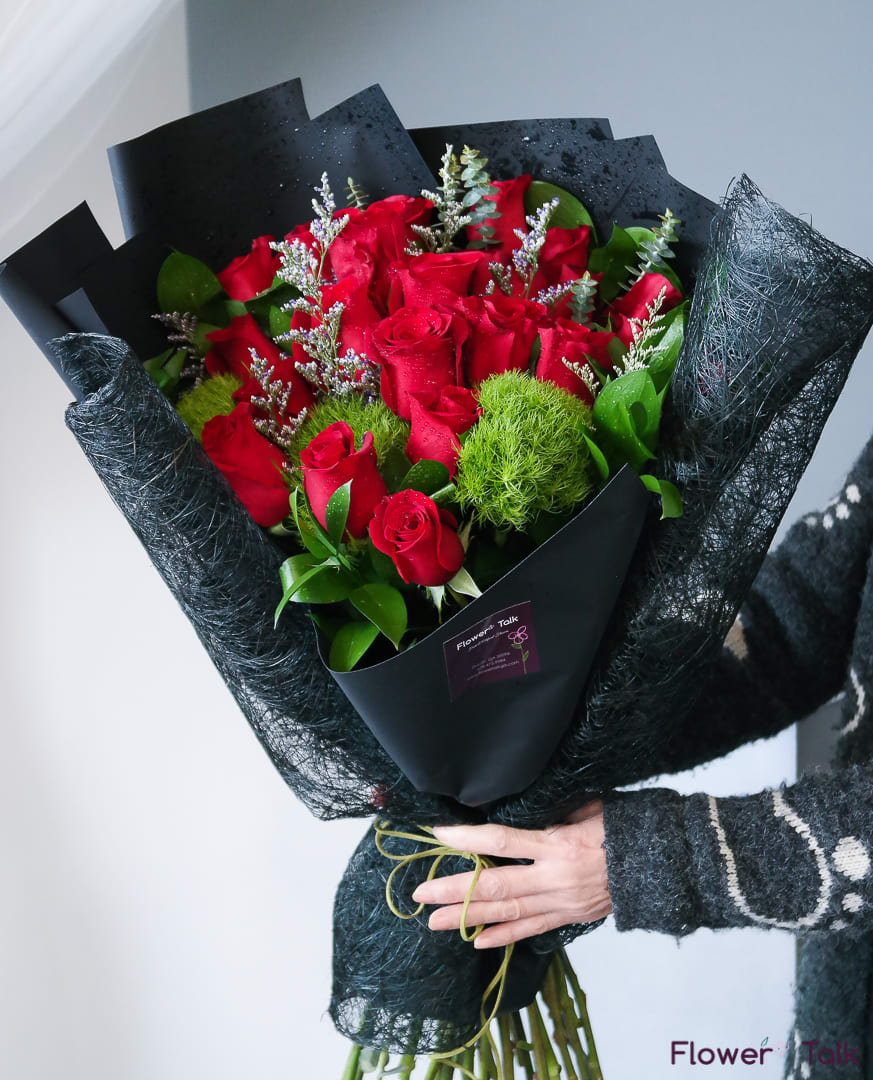 Romantic Red Rose Hand Bouquet (Vase not included) - Impress your lover with this romantic, classy bouquet.  This bouquet does not come with the vase.  Standard size: 16 red roses with greenery wrapped as a hand bouquet.  Deluxe size: 20 red roses with greenery wrapped as a hand bouquet.  Premium size: 24 red roses with greenery wrapped as a hand bouquet.