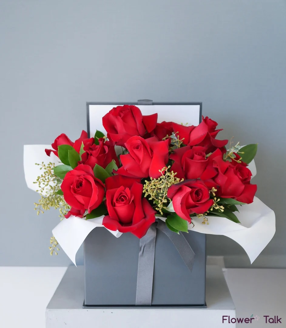 Just You Flower Gift Box - A romantic, modern floral gift box. This arrangement includes red roses and seeded eucalyptus.  Standard size: Approximately 12 roses Deluxe size: Approximately 16 roses Premium size: Approximately 20 roses
