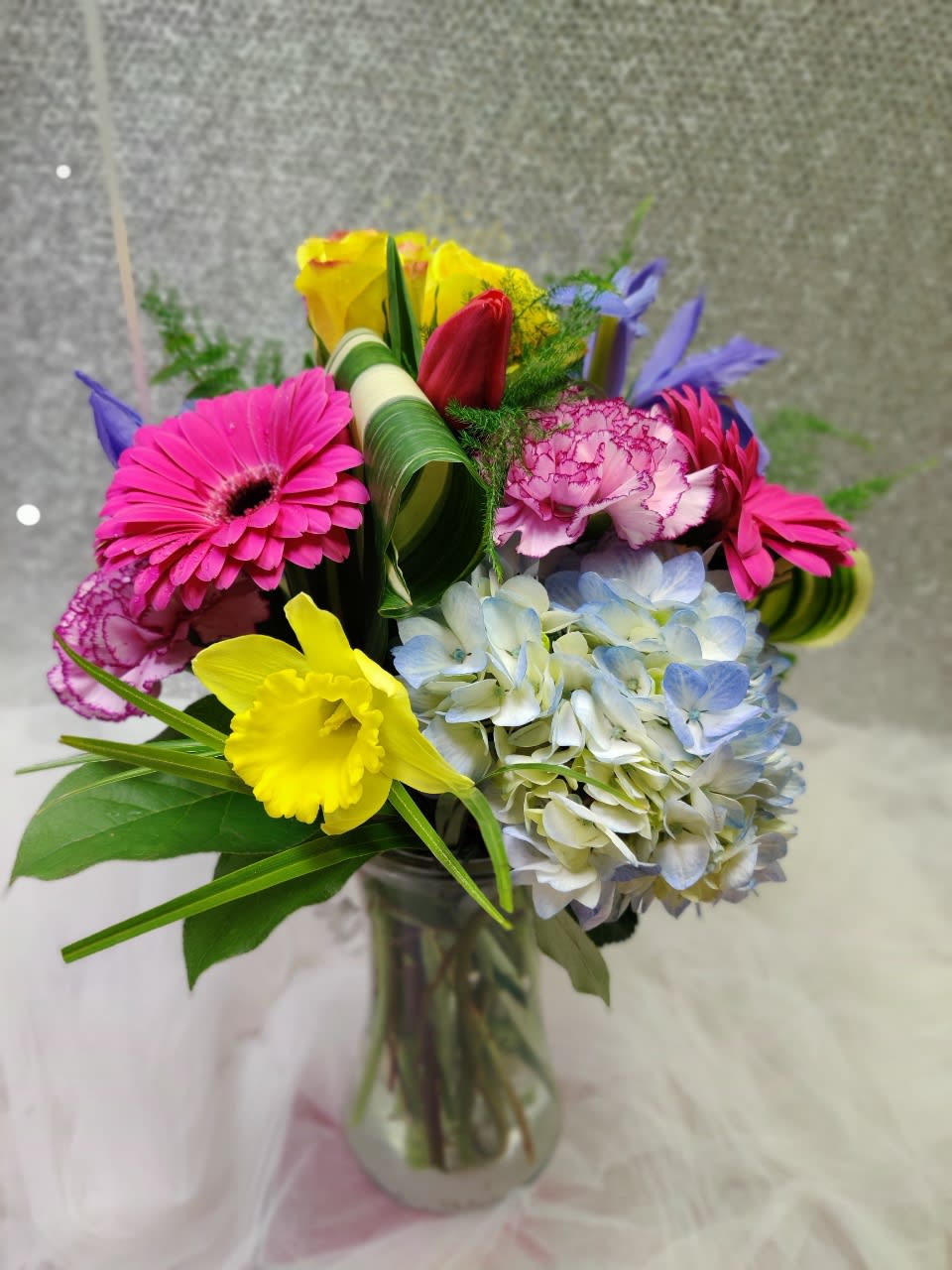 Loving You - Contains Roses, Hydrangeas, Gerbera Daisy, Daffodils,. Iris, Carnations and Tropical Greenery