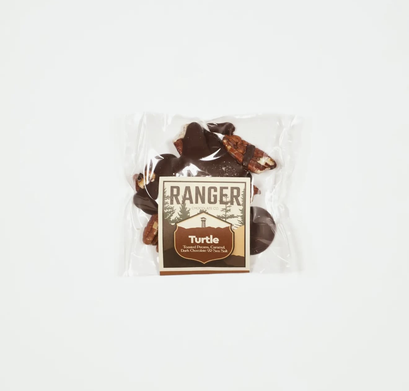 Turtle - Ranger Chocolate - We start with high quality pecans, lightly toasted them to enhance flavor and texture. These are topped with our honey caramel, Classic Dark Chocolate and a touch of Jacobsen Flake Sea Salt. Individually wrapped for freshness, and great to share with friends and family.
