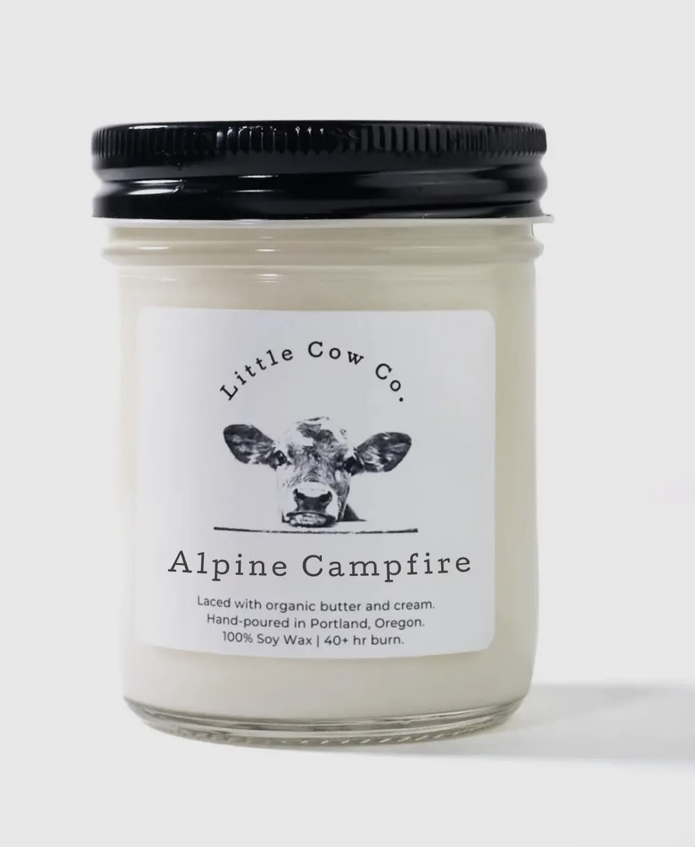 Alpine Campfire - Jar Candle - If contentment had a smell, it would be Alpine Campfire: the rich scent of smoked birch, sweet, earthy amber, and spicy hints of leather captures the pure relaxation of lounging next to an alpine lake, listening to the sounds of laughter around a warm, crackling fire.   100% natural soy wax. Laced with organic butter. Reusable jar with sealing lid.  50+ hr. burn time