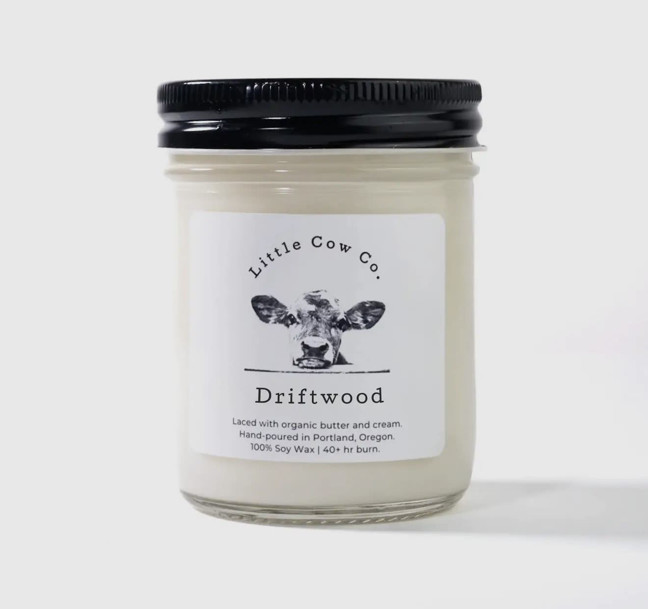 Driftwood - Jar - Imagine walking along the Oregon coastline, the stormy ocean for company and cool wet sand between your toes, and picking up an intricate sea-carved piece of driftwood. With breezy sea salt, musky sandalwood, and herbaceous coriander, the Driftwood candle is like bringing home that aromatic piece of natural art. Just without the sand.   100% natural soy wax. Laced with organic butter. Reusable jar with sealing lid.  50+ hr. burn timeI