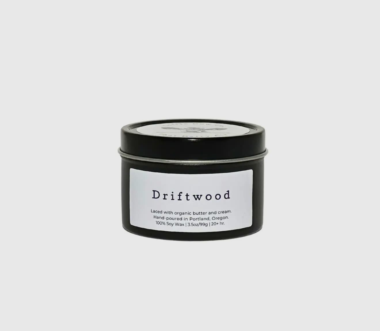Driftwood Travel Tin Candle- 3.5 oz - Imagine walking along the Oregon coastline, the stormy ocean for company and cool wet sand between your toes, and picking up an intricate sea-carved piece of driftwood. With breezy sea salt, musky sandalwood, and herbaceous coriander, the Driftwood candle is like bringing home that aromatic piece of natural art. Just without the sand.   100% natural soy wax. Laced with organic butter.