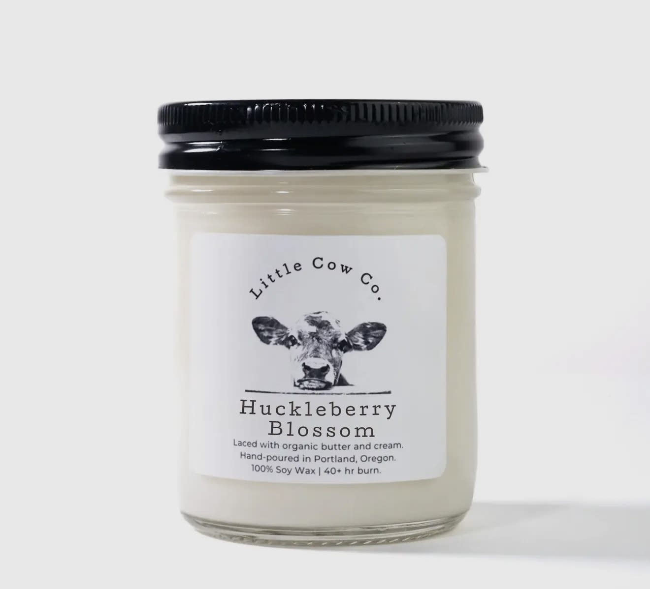 Huckleberry Blossom - Jar Candle - It's a special time of year when Oregon and Washington explode in wild berries, making the late summer air pregnant with sweetness. Huckleberry Blossom brings that delicious wonder into your home any time of year, with ripe huckleberry, sweet nectar and complex notes of honey. Even more decadent? Our candles are laced with butter, so try not to salivate over the smell of fresh-baked huckleberry pie. And please, even though Huckleberry Blossom is made with organic butter and natural soy wax, don't eat the candle – But we won't blame you for wanting to.  100% natural soy wax. Laced with organic butter. Reusable jar with sealing lid.  50+ hr. burn time