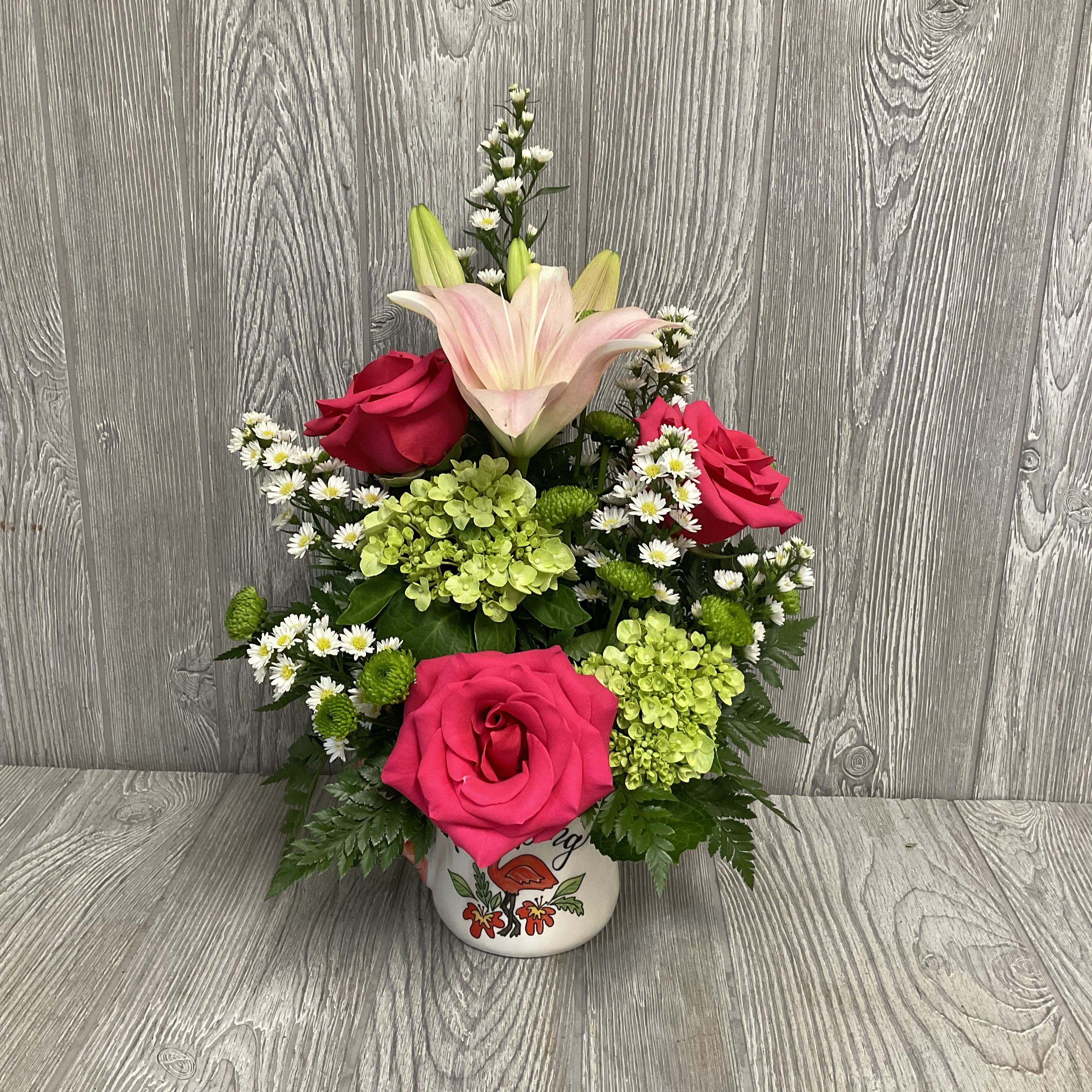 Flamazing - Celebrate your special someone with a fun arrangement of roses, Gerber daisies, and snapdragons in a “You are Flamazing” mug.