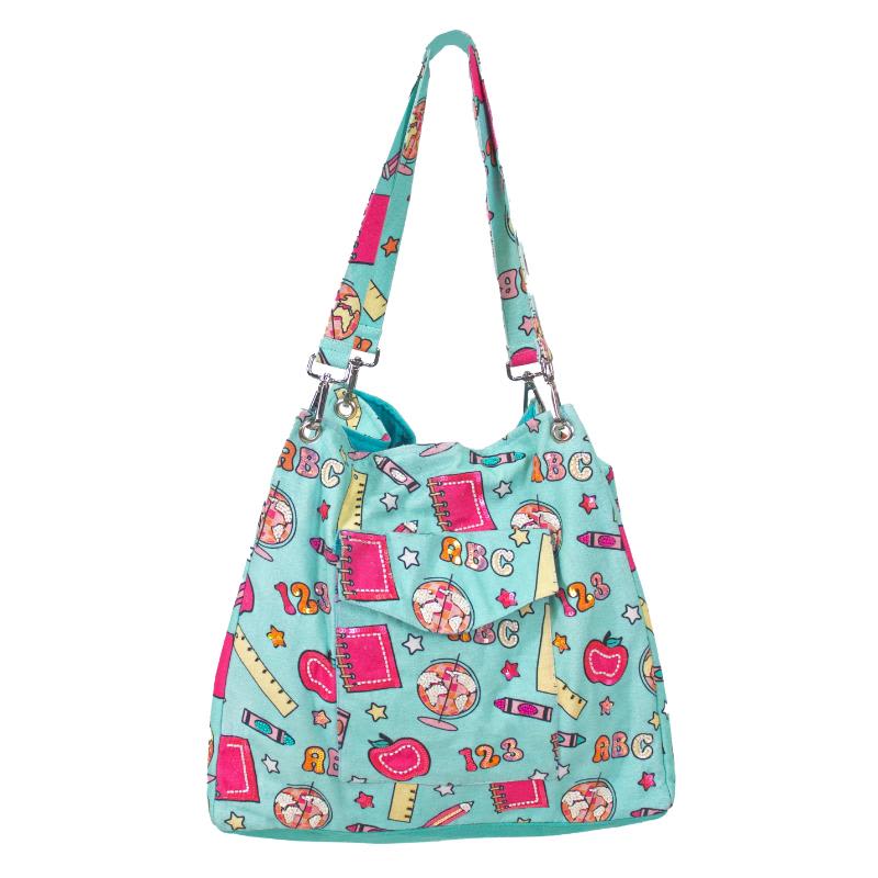 Turquoise fabric shoulder bag with colorful school-themed print and long strap