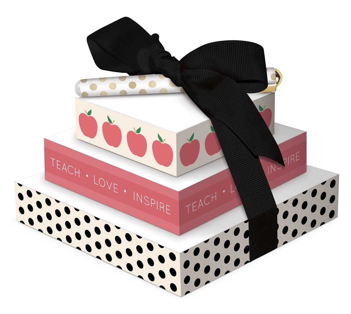Stacked decorative gift boxes tied with a black ribbon