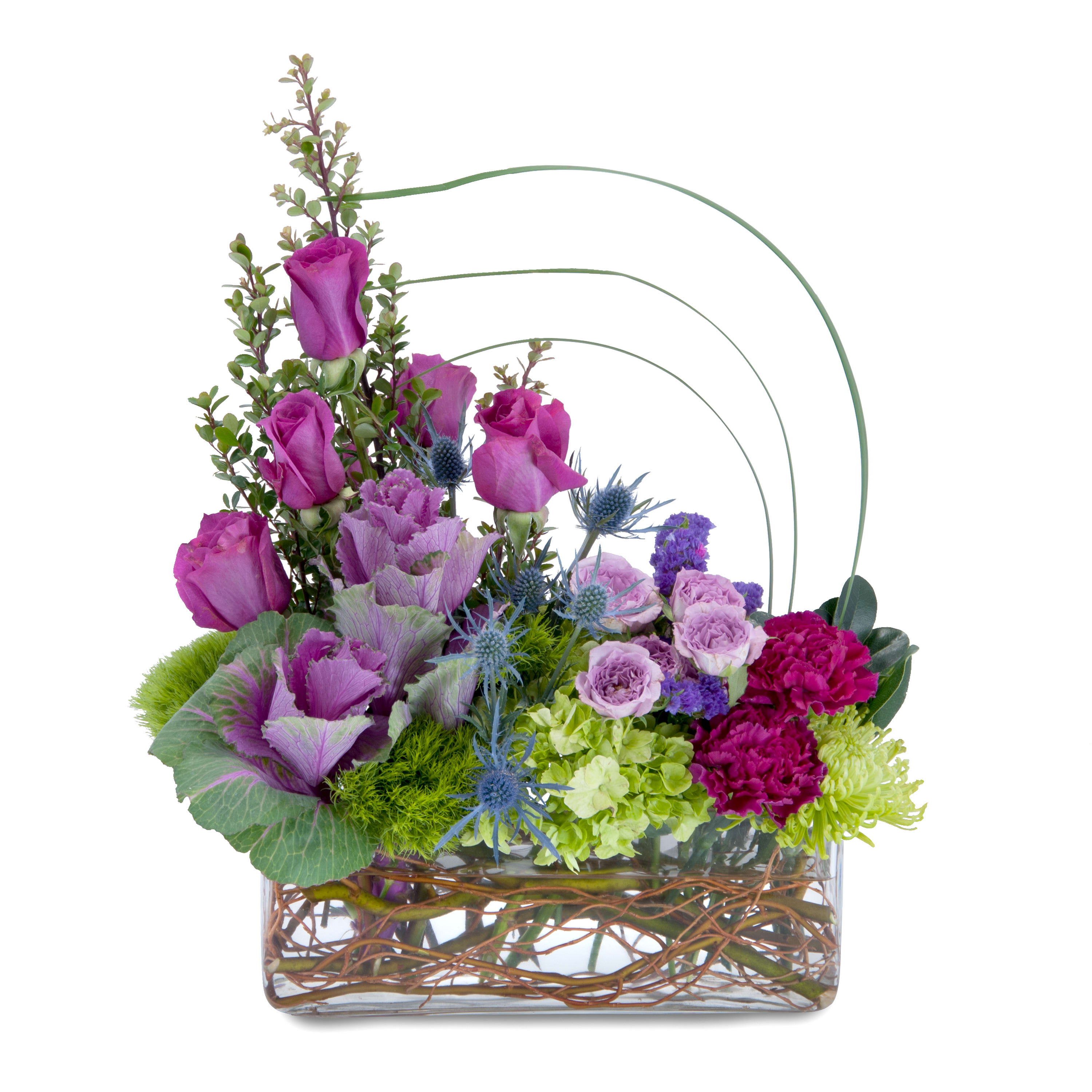 Modern purple and green floral arrangement with roses and hydrangea in a clear rectangular vase