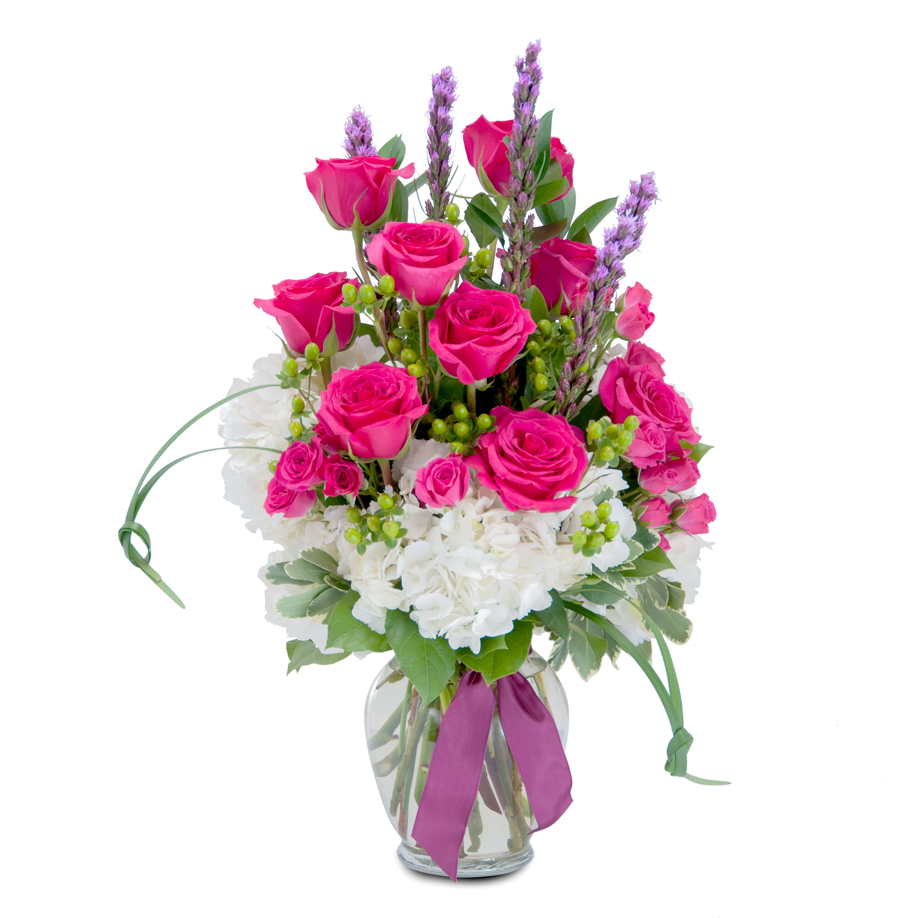 Unconditional Love - A bright and bold combination of gorgeous hot pink roses and spray roses, white hydrangea, liatris and assorted foliage. Designed in a clear glass vase and finished with a ribbon tie. Remember your unconditional love with the gift of this beautiful arrangement. DGTMF146C