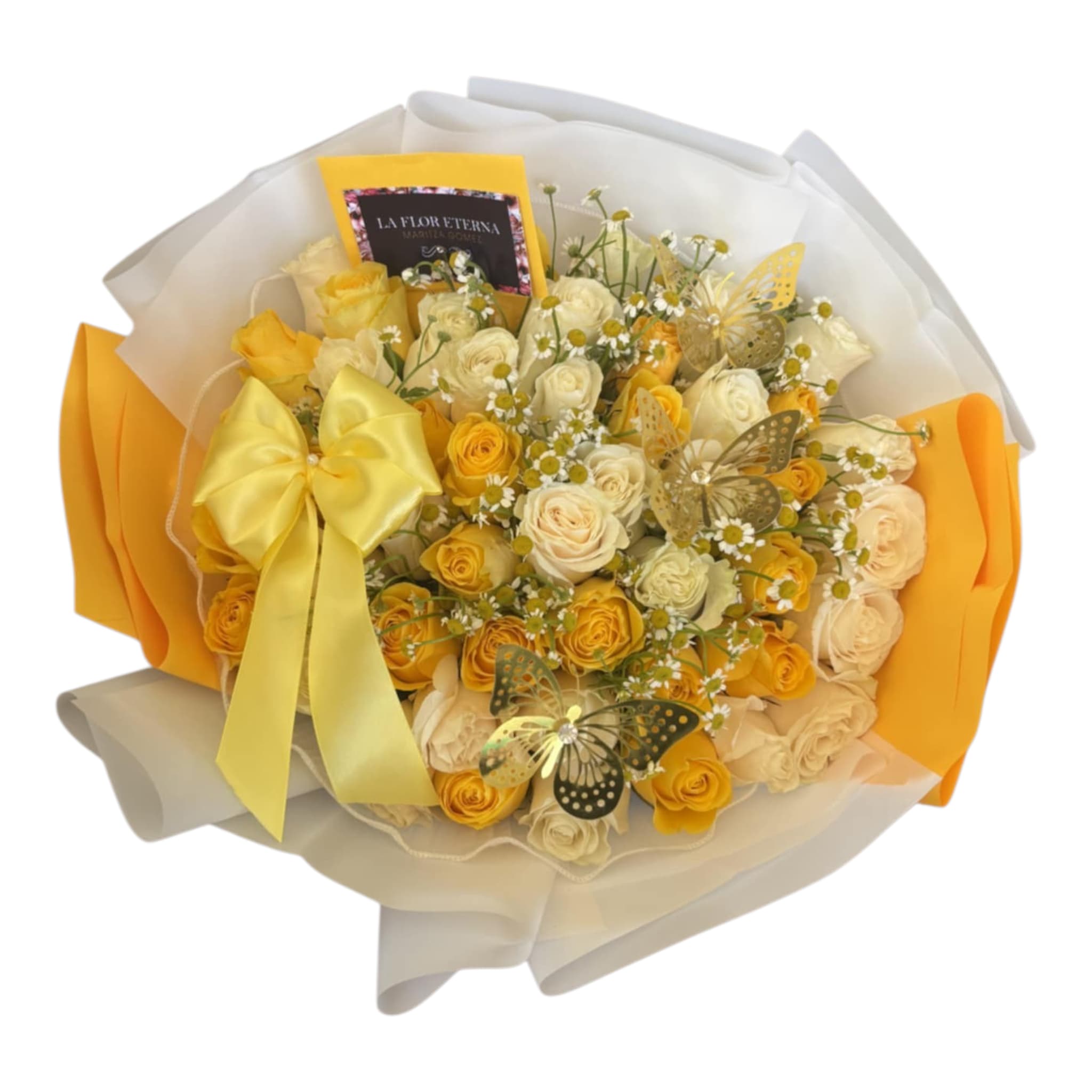 Manzanilla Love - A sunny cluster of white  and bright yellow roses creates an immediate cheerful impression-the kind of birthday bouquet or Mother's Day arrangement that makes someone feel truly celebrated. Bright white and yellow roses mingle with small white daisy-like blooms for a soft, textured look, while metallic gold butterflies tucked among the flowers add a playful, whimsical accent perfect for congratulations or a heartfelt thank-you.  For a polished, gift-ready presentation. The color palette of yellow, white, reads warm and uplifting; the compact, round shape keeps the arrangement intimate and easy to hold. A greeting card is included so you can add a personal message, making this an ideal choice when you want the person you're thinking of to feel brightened and truly seen.