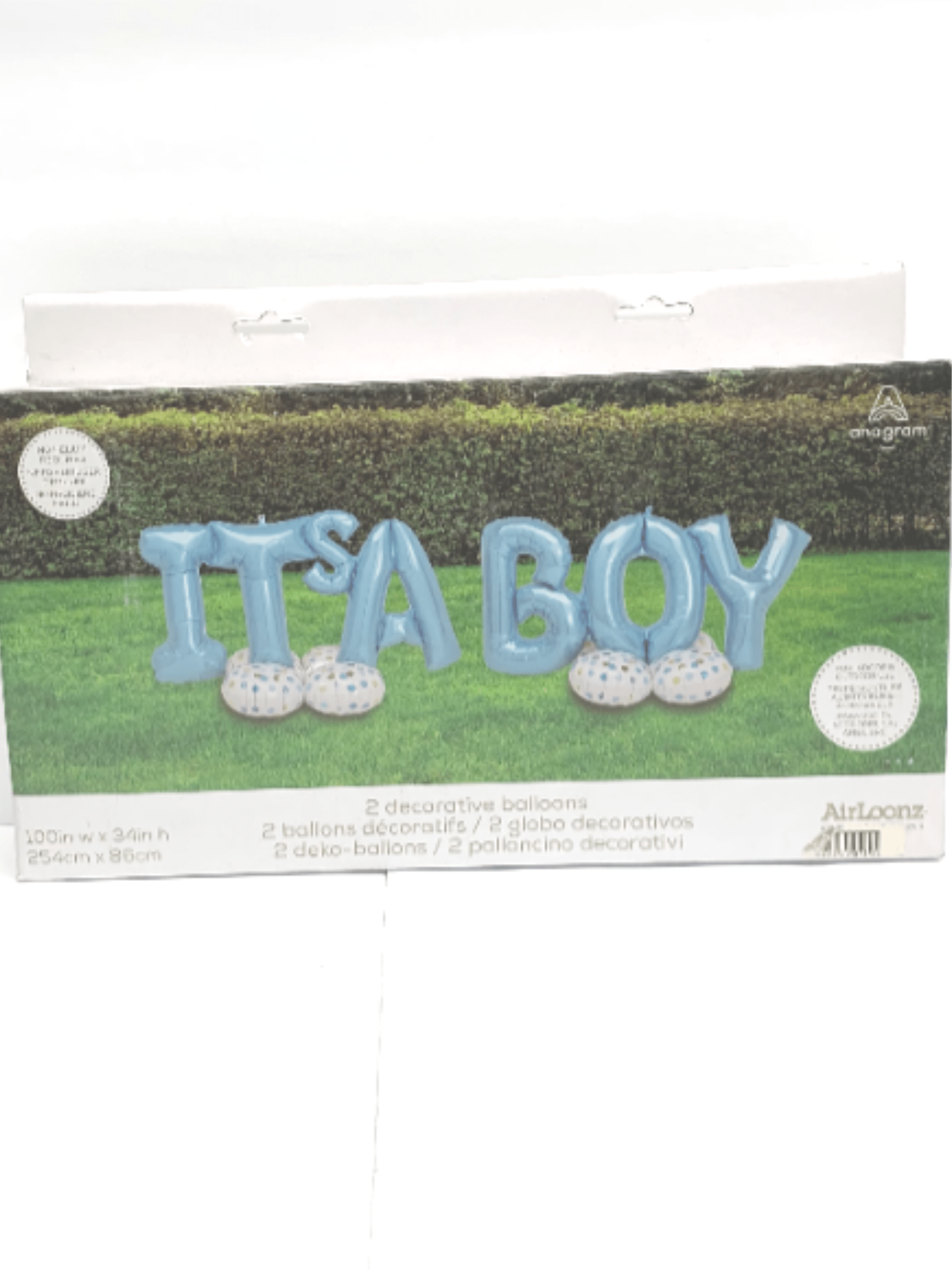 Blue 'It’s a Boy' letter balloons on white dotted bases on a lawn backdrop