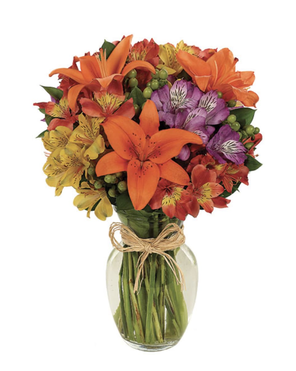 Bright and Simple Bouquet - Lilies, alstroemeria and more in a rose glass vase tied with raffia.