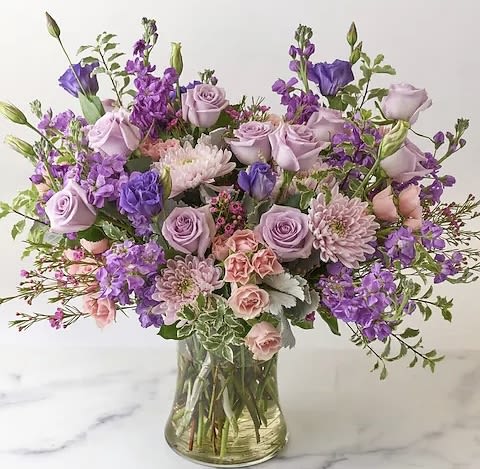 DESIGNER'S CHOICE - Lavender Blooms (SEASONAL) - Select our Designer's Choice - Lavender Blooms Bouquet arrangement to brighten your loved ones day this week.   *SEASONAL - FLOWERS MAY VARY DUE TO AVAILABILITY