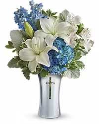 Blue &amp; White Serenity Sympathy Arrangement - A serene and elegant sympathy floral arrangement featuring white lilies, blue hydrangea, blue delphinium, and white alstroemeria, beautifully accented with fresh greenery. Arranged in a silver cross-embossed vase, this thoughtful design offers a dignified and heartfelt expression of remembrance, peace, and sympathy.  Perfect for honoring a cherished life, this arrangement combines classic white and soothing blue tones to convey comfort and respect during a difficult ti