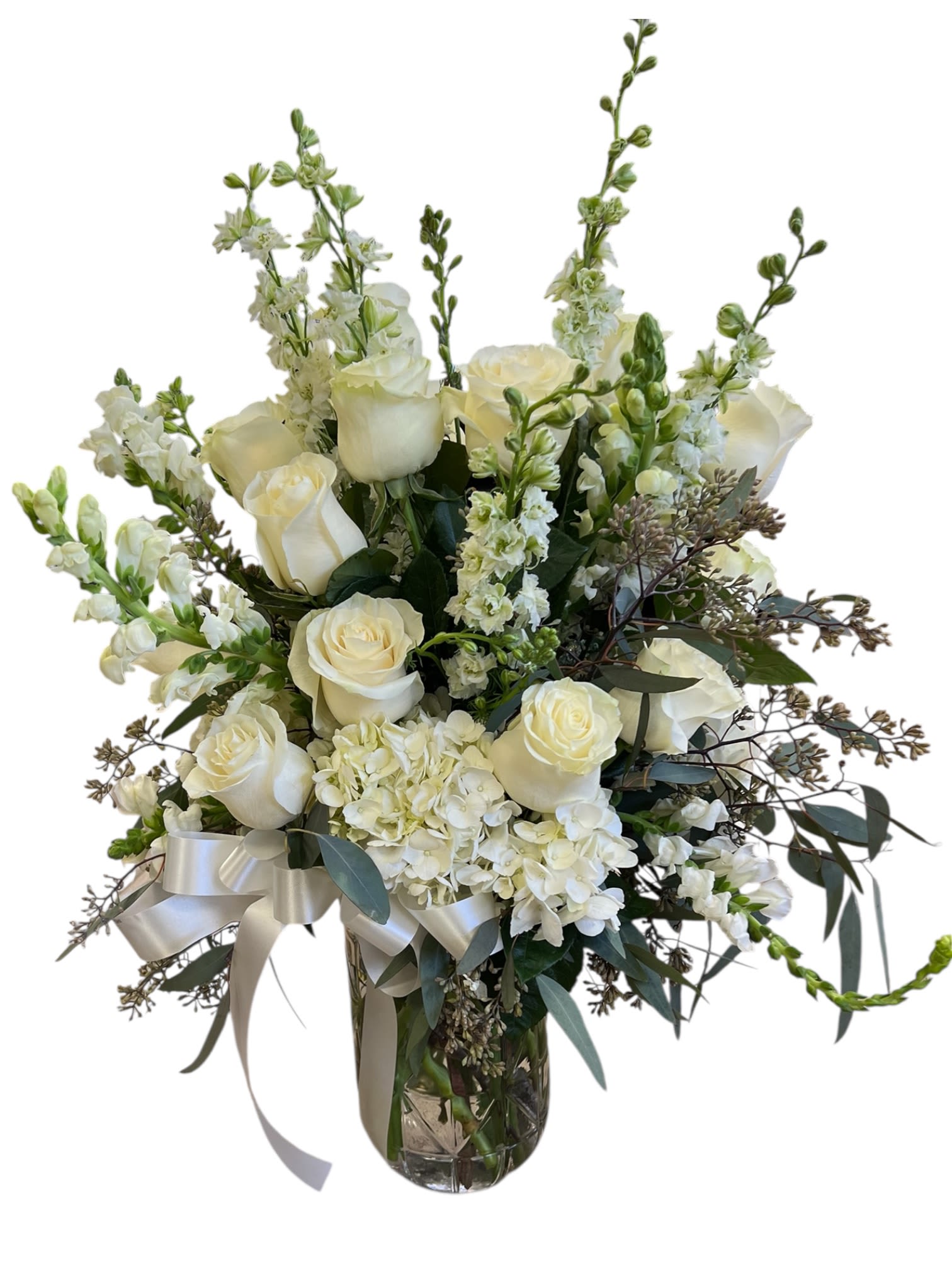 Serenity Bloom - This timeless all-white arrangement brings a sense of serenity and respect, making it suitable for funeral services, memorials, or sending sympathy to the family’s.