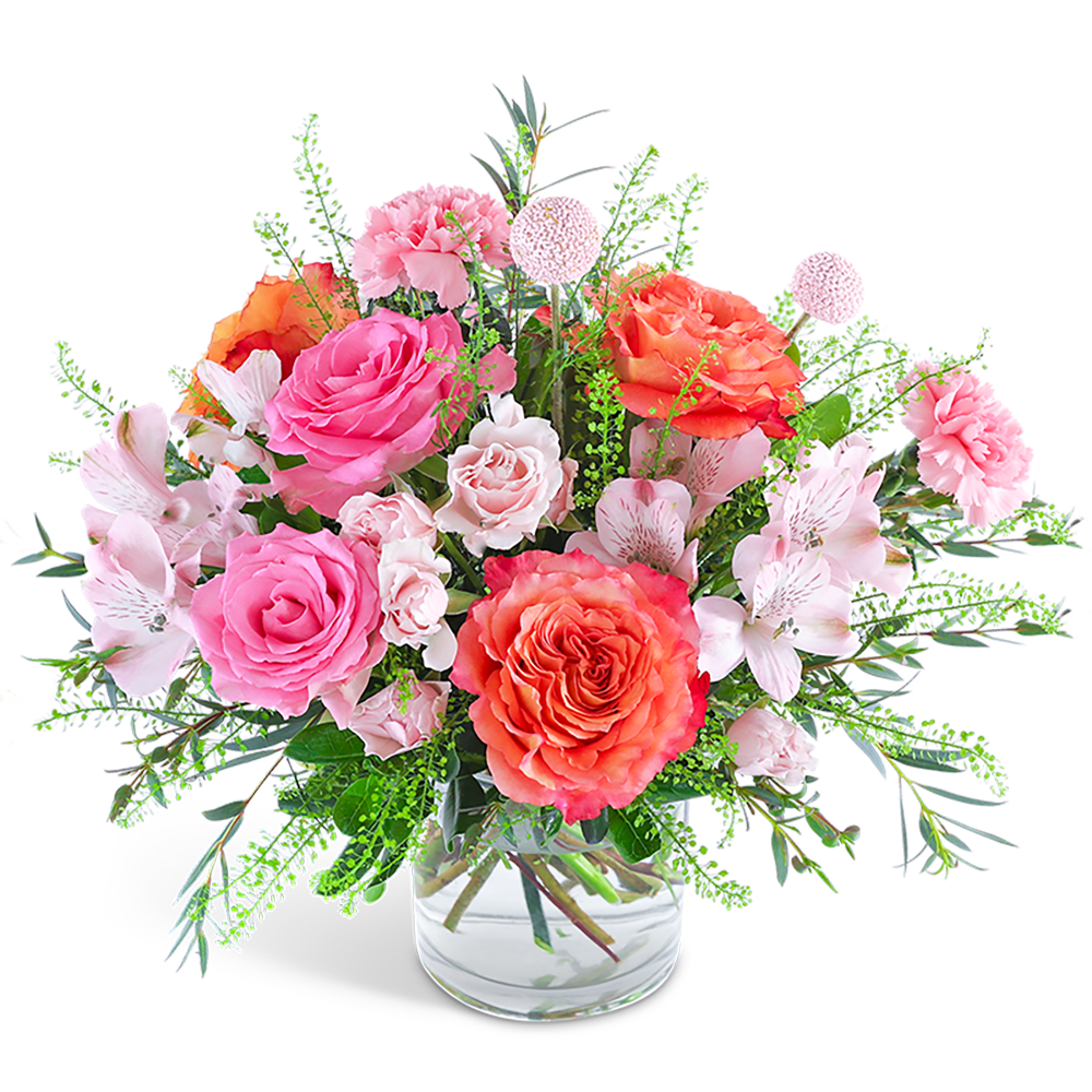 Florence Spirit - "Our Florence Spirit floral design features a gorgeous blend of hot pink and coral tones. With its combination of roses, carnations, Alstroemeria, and premium foliage arranged in a clear glass vase, this bouquet provides a delightfully inspiring touch to any occasion.  At our flower shop, we continually update our flower inventory based on the seasons and market availability. The images you see here give you an overall idea of the size and style of our arrangements. We strive to provide same-day flower delivery in most instances, so kindly ensure that you provide us with the complete address and contact details of your recipient to guarantee a smooth direct delivery."