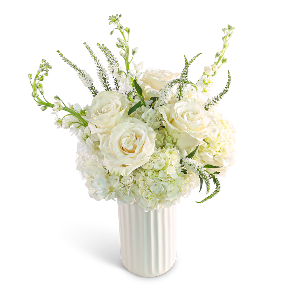 Simply Pure White - "Our Simply Pure White design features an elegant white color palette, with White Hydrangea, Roses, Veronica, Stock, and premium foliage. This timeless arrangement exudes a sense of tranquility and sophistication, perfect for any occasion. Its serene beauty makes it a perfect choice for adding a touch of purity and grace to any space. As a trusted local florist, we take pride in every order, offering hand-crafted flower designs delivered directly to the recipient. Our flower shop is committed to providing the highest quality, freshest flowers, and ensuring timely delivery for every arrangement."