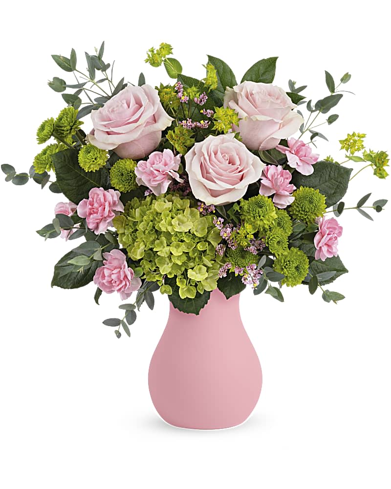 Pink roses, green hydrangea, and mixed pink and green blooms in a pink vase