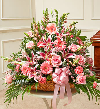 Thoughts and Prayers Fireside Basket - Pink - Product ID: 91201   Express your deepest sympathies with this fireside basket that makes a touching tribute. Roses, stargazer lilies, carnations, Gerbera daisies, snapdragons and more are arranged by our expert floral designers Traditionally sent by family, friends or business associates Delivered directly to the funeral home Our florists use only the freshest flowers available so varieties and colors may vary 