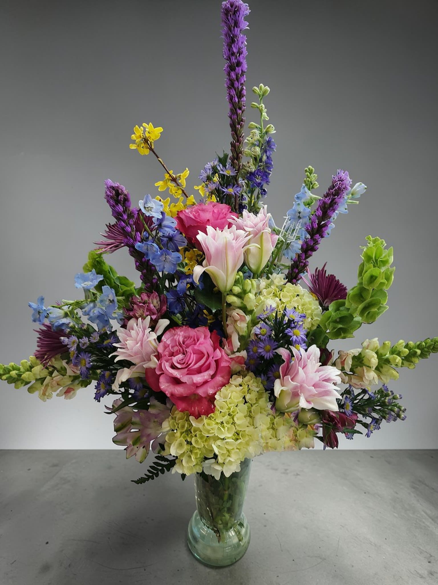 Lovers Song by Art and Flowers - Lovers Song is a colorful tribute to your special someone, that is always there for you. We fill a vase with the seasons best and finest blooms. Each design is a bit different just like all lovers.