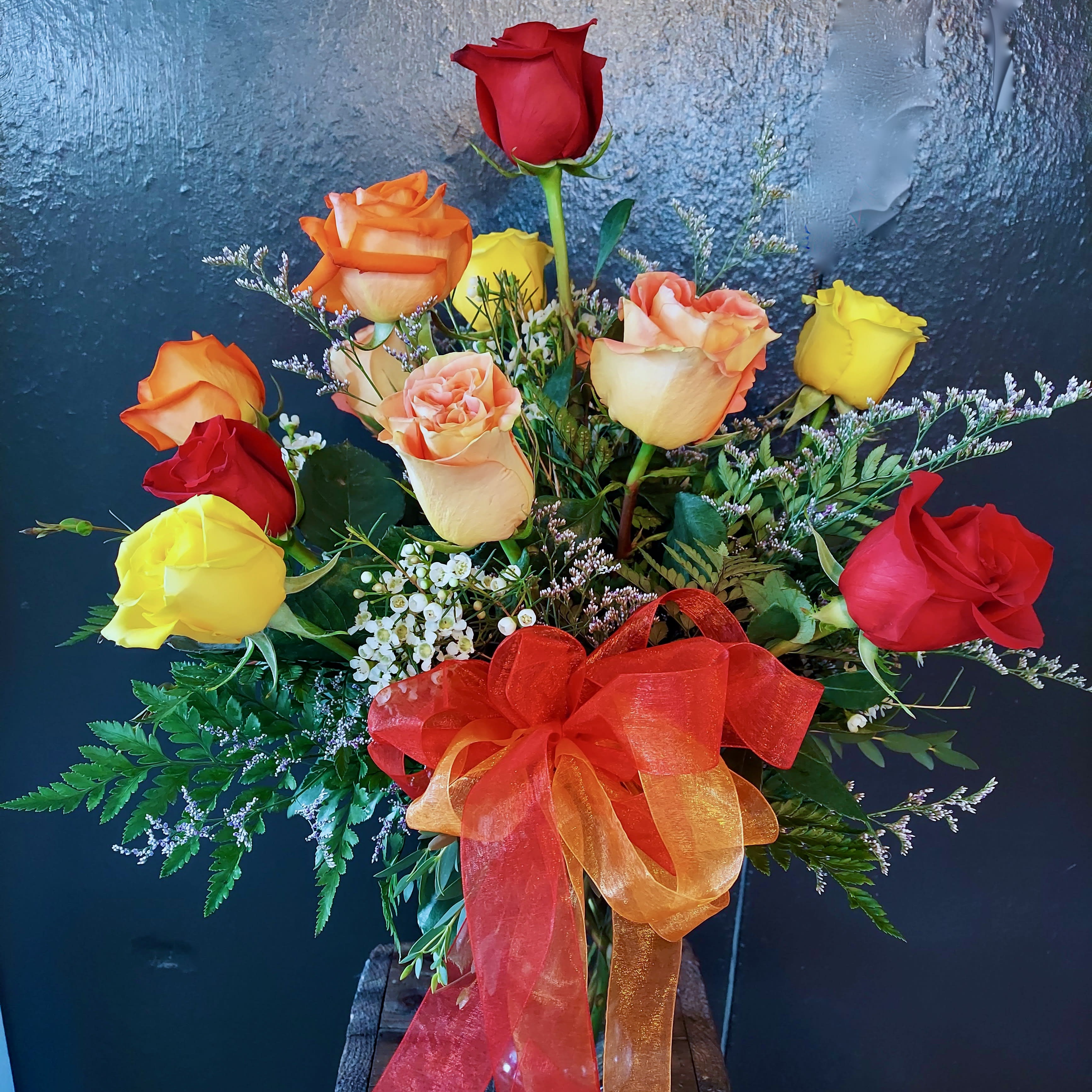 Fire and Ice - Vibrant red, peach &amp; yellow roses with a splash of icy white.  This custom Sunnyside Specialty is sure to warm you up this winter.  