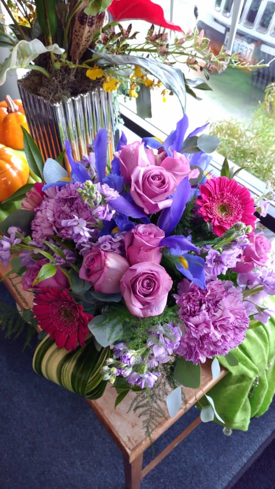 Lovely Luxe - Includes Roses,  Iris,  Gerbera Daisy,  Carnations,  and Stock.