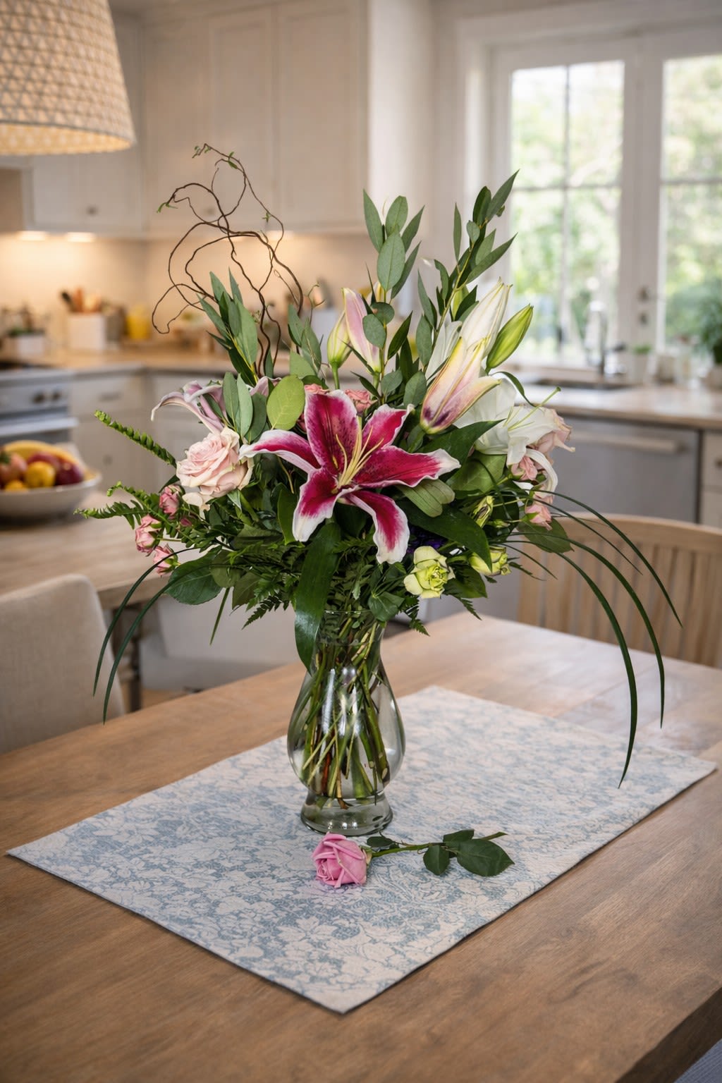 Only For Mom! (GM Favorite) - Wow Mom with our extremely popular arrangement, featuring a beautiful combination of roses, lilies, and other seasonal flowers—back by popular demand! This stunning bouquet is sure to bring joy and brighten Mom’s special day with its vibrant and elegant design.  Key Features: Popular Flower Combination: A stunning blend of roses, lilies, and seasonal blooms, creating a timeless, elegant look.  Size: This is a larger piece sure to fill a room or office!  Back by Popular Demand: A fan-favorite, loved for its beauty and versatility.  Perfect for Mother’s Day: A thoughtful gift to show Mom just how special she is.  Vibrant and Elegant: The mix of colors and textures brings both brightness and sophistication to any space.  Fresh and Seasonal: Includes the freshest seasonal flowers for long-lasting beauty.  