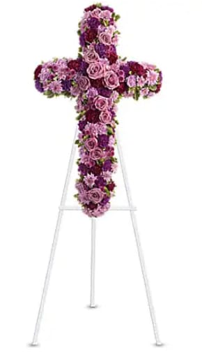 Deepest Faith Standing Spray - Pride, dignity, admiration and faith are on beautiful display in this moving sympathy arrangement. It's a meaningful way to deliver your heartfelt message. Beautiful flowers such as lavender roses, carnations and cushion spray chrysanthemums along with fuchsia and purple carnations and button spray chrysanthemums create a dazzling cross that is full of hope and devotion.   Orientation : One-Sided    