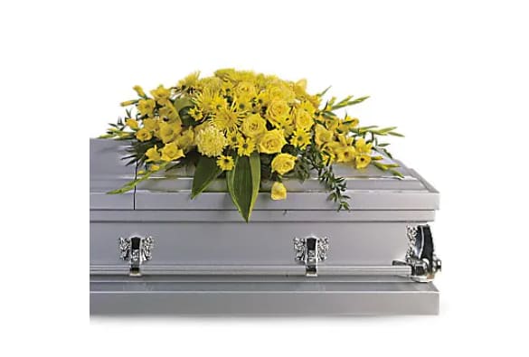 Graceful Grandeur Casket Spray - "Joyous times and golden memories are recalled with this lovely half-couch casket spray that consoles the bereaved with a sunny array of beautiful blooms. A bevy of yellow blossoms such as roses, gladioli, chrysanthemums and more are perfectly arranged in this lovely casket spray.   Orientation : N/A  All prices in USD ($)  Standard  T242-1A"