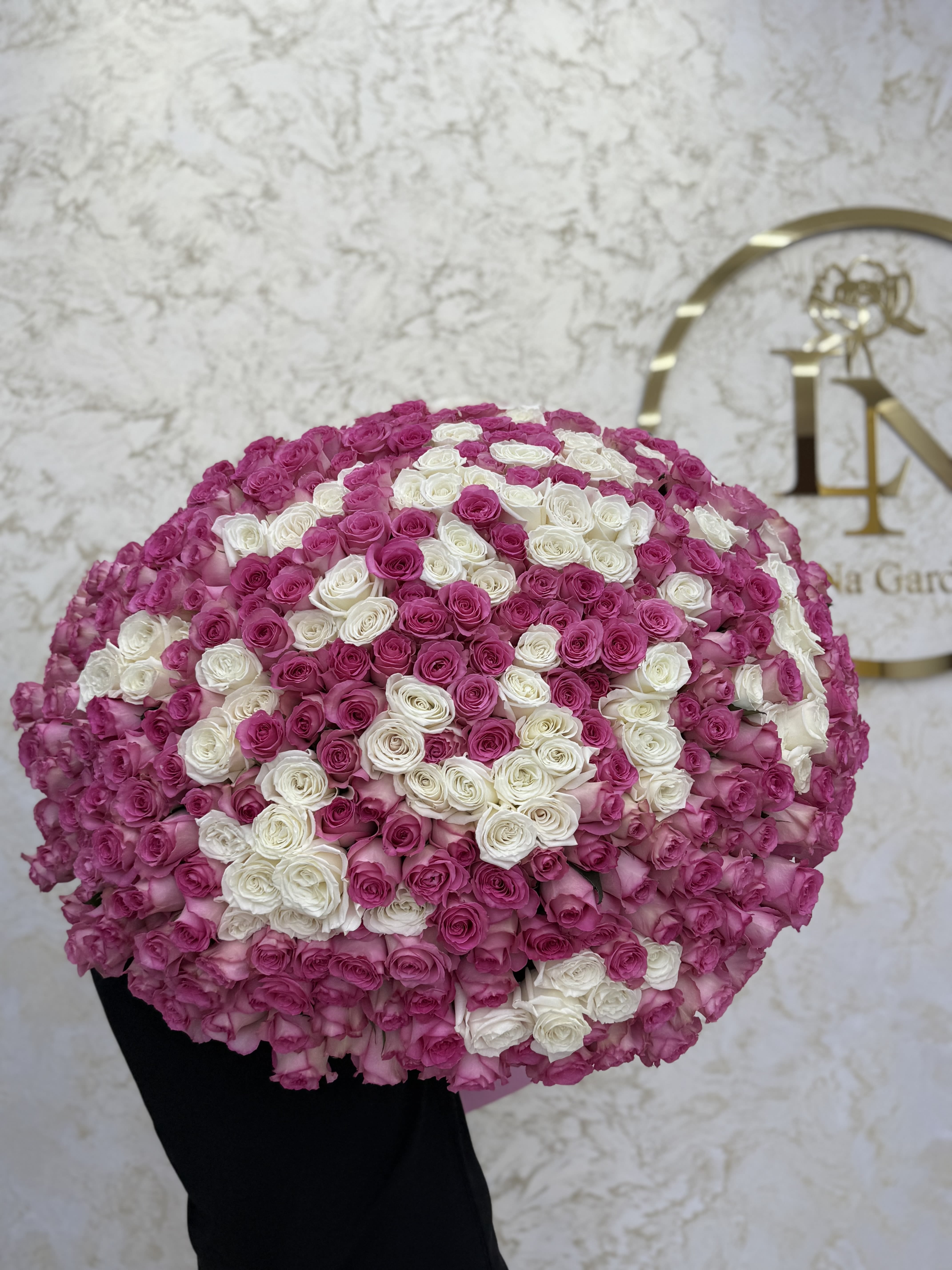 Large round bouquet of pink and white roses