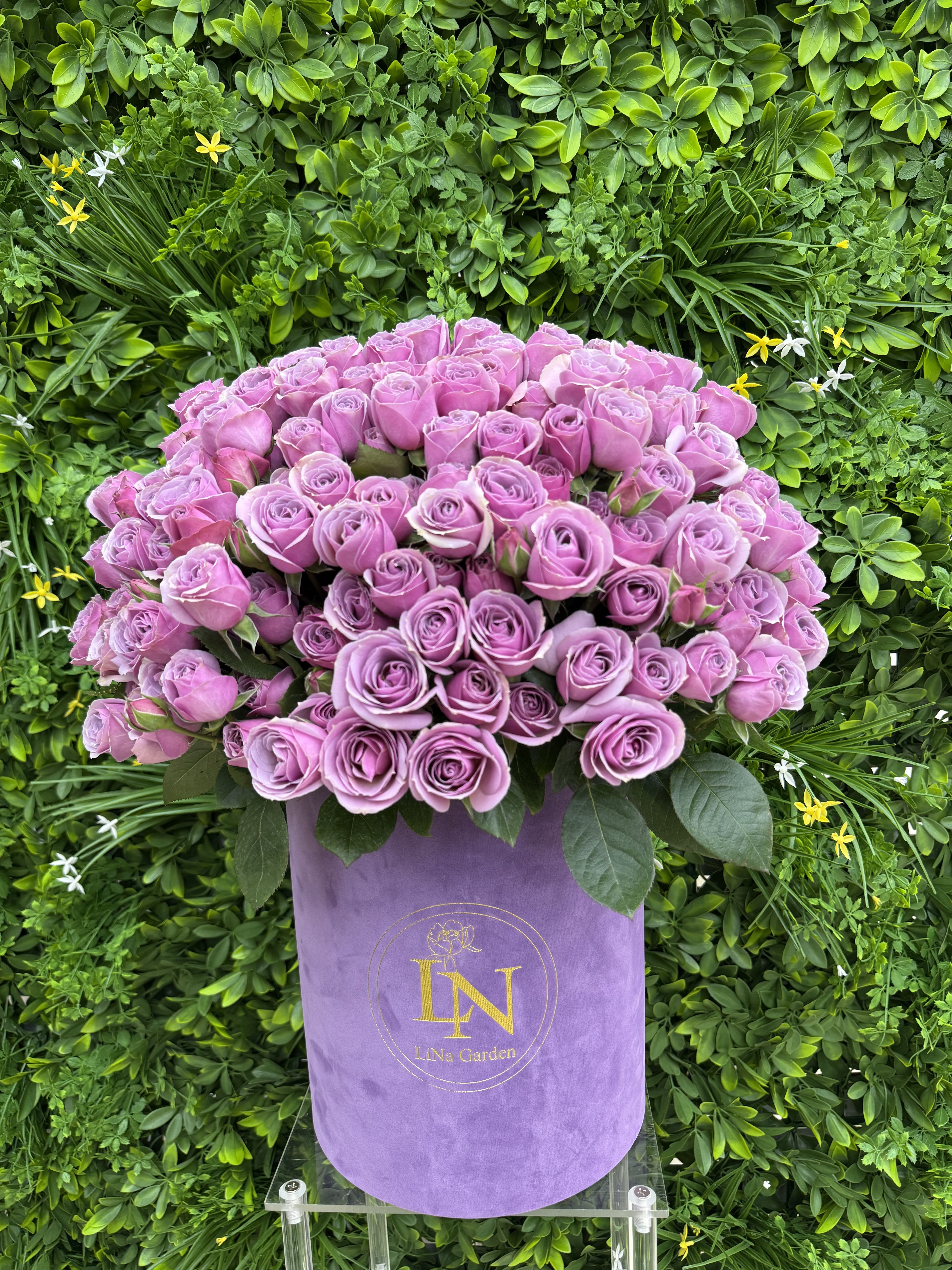 Lavender rose bouquet in a purple hat box