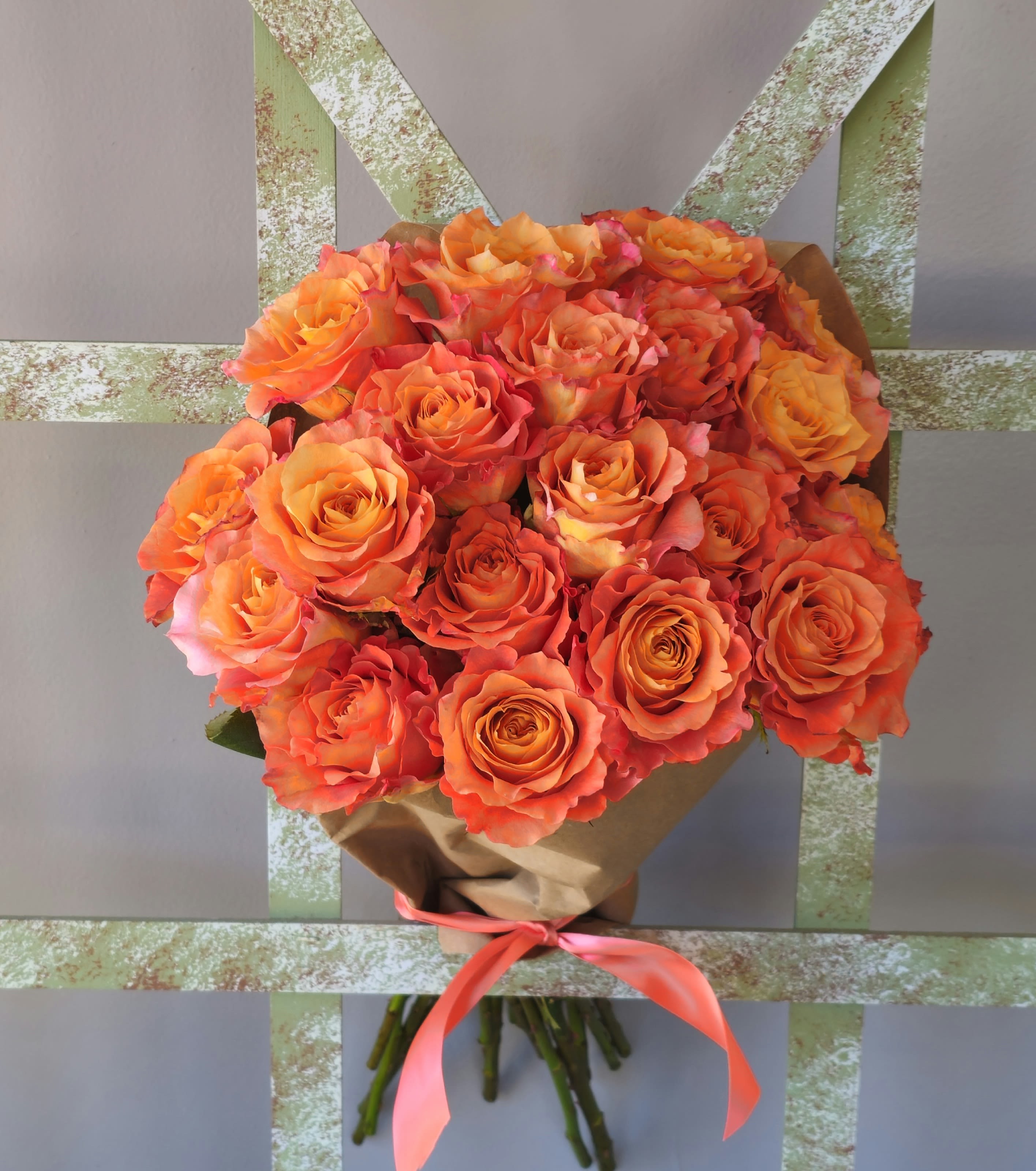 25 roses wrapped in paper - Romantic roses wrapped for a stunning bouquet....please call the shop for color choices