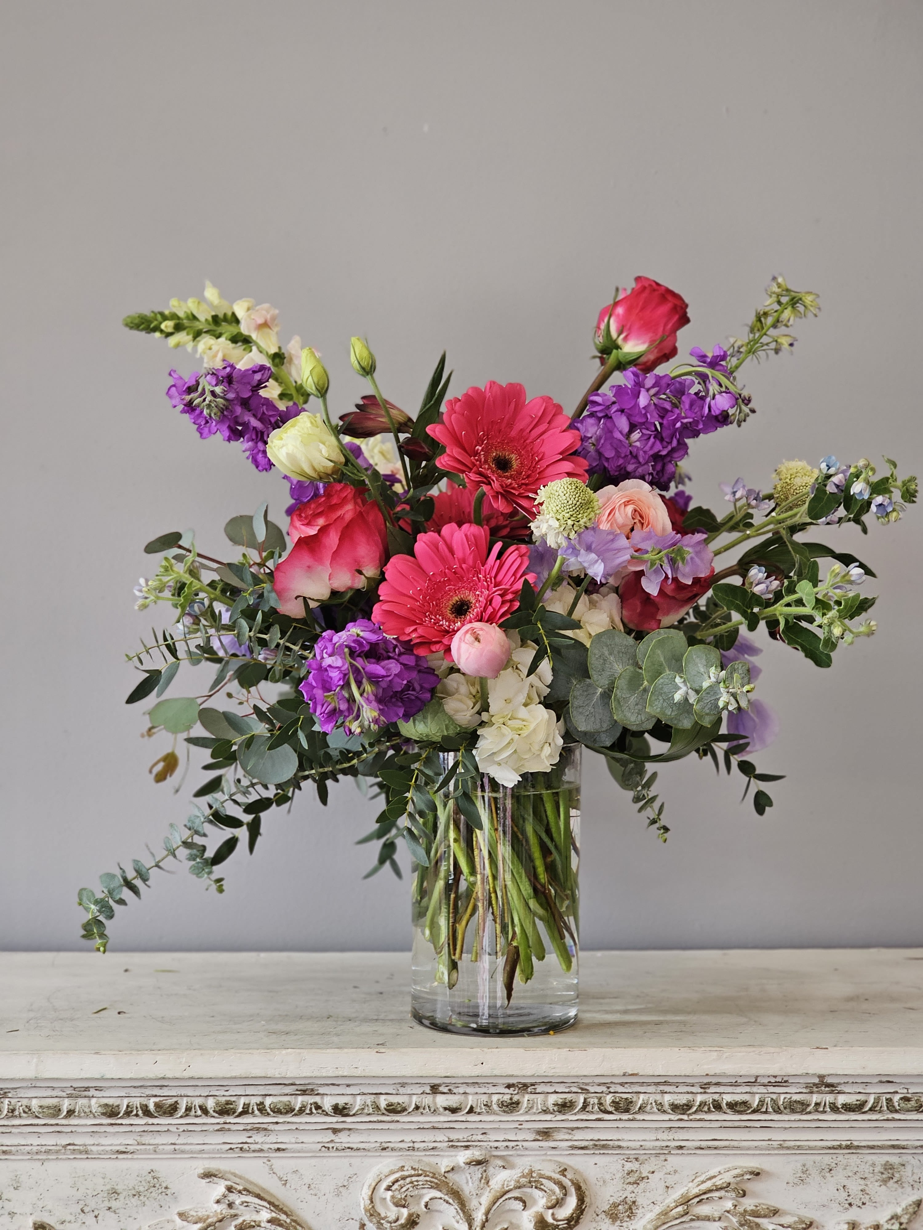 Strawberry Wine - Shades of strawberry and lovely pastel flowers including roses create this lovely, textural vase of flowers. Enjoy!