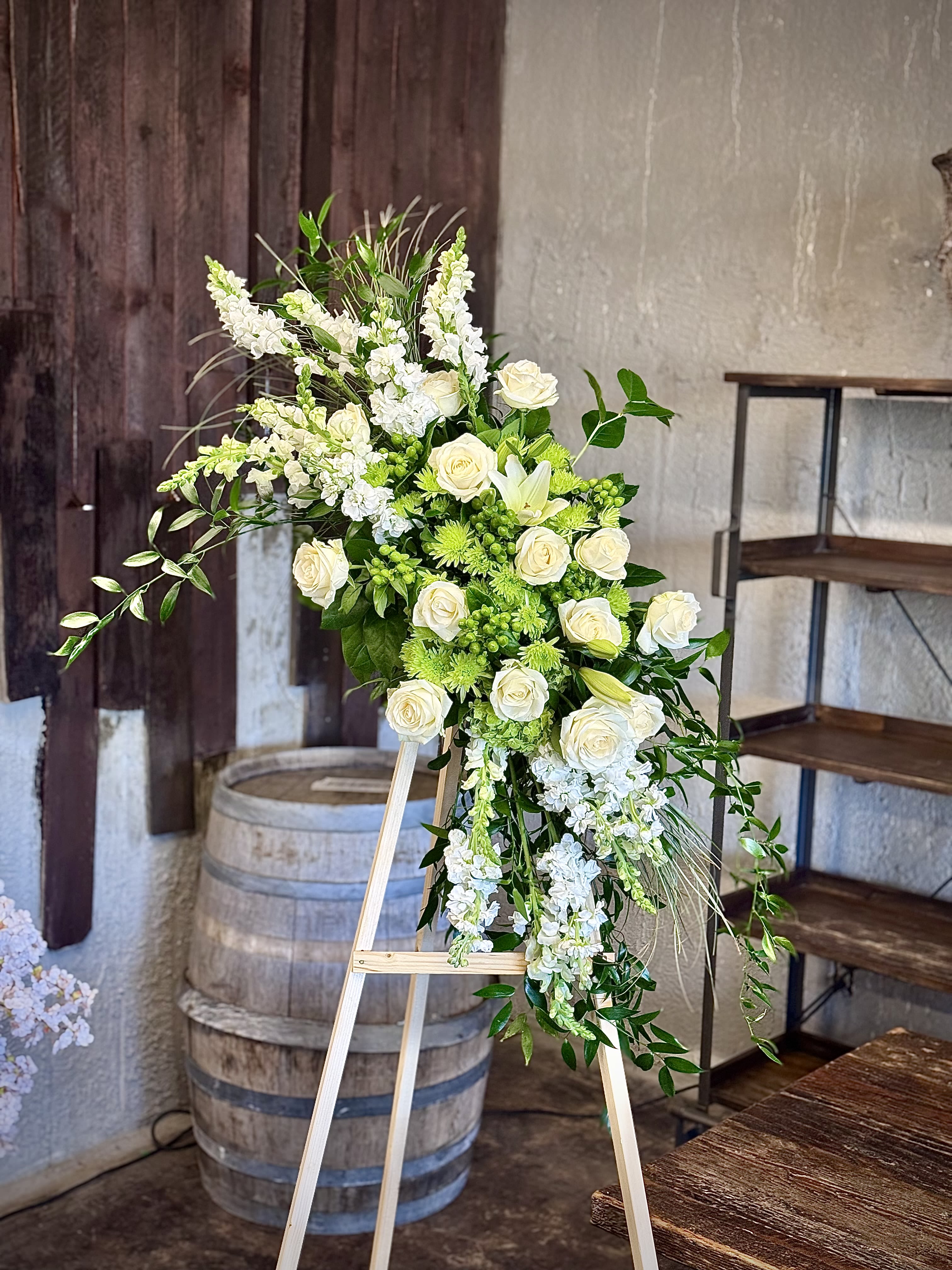 Sweet Farewell - When your feelings of loss and sorrow compel you to make a grand gesture of sympathy, this dramatic, standing arrangement is a lovely way to convey your sincerest condolences. This extraordinary composition of pink blooms and lush greens handcrafted by an FTD artisan florist includes roses, carnations, gladiolus and Stargazer lilies set among lush, contrasting greenery. Made to be displayed on an easel, it makes an appropriate choice for a wake, funeral or graveside service, sure to be much appreciated and long remembered.