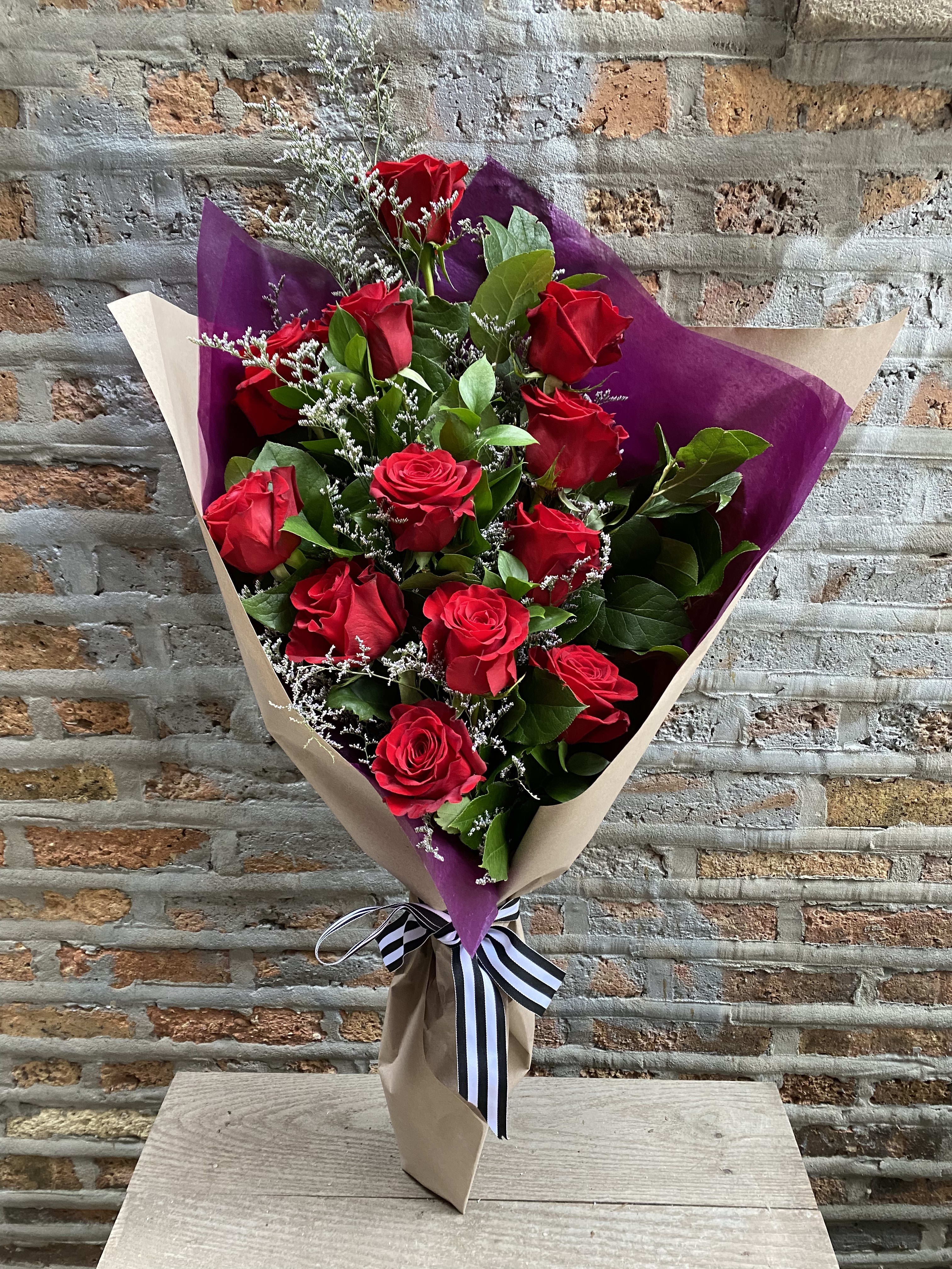 Red Roses - 12 Long Stem  - Dozen long stem roses with greenery in presentation style. Available for IN STORE PICK UP or local delivery.