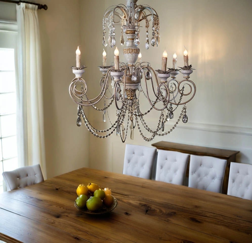 Vintage Style Antique Reproduction Wood Chandelier - Special Order only for pick up or delivery (6-7 days) Featuring intricate detailing, a weathered wood finish with gold-toned metalwork accents, and eight candle-style arms, these chandeliers exude timeless elegance while providing warm, ambient lighting. Measuring approximately 35 inches in diameter and 35 inches in height, each hand-finished piece is a durable masterpiece designed to elevate the aesthetic of any setting.