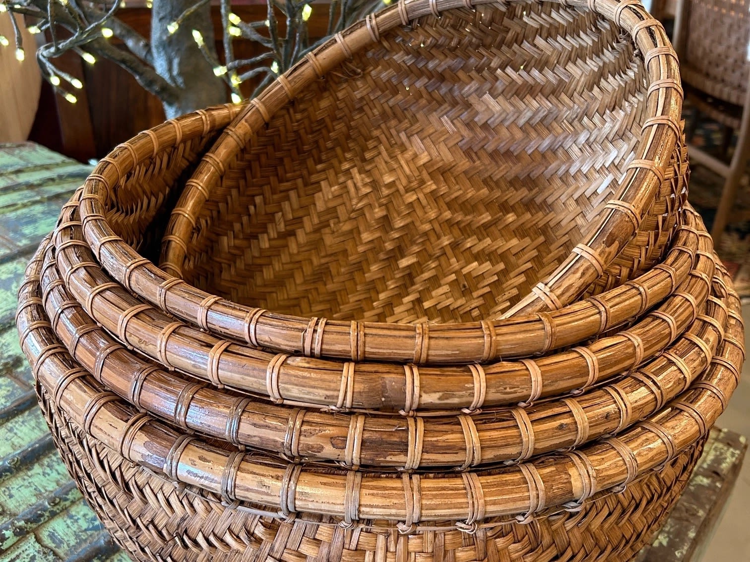 Handwoven Bamboo Nesting Baskets – Set of 5 - Handwoven Bamboo Nesting Baskets – Set of 5 Celebrate timeless craftsmanship with our set of five handwoven bamboo baskets, designed to nest seamlessly for space-saving storage and layered visual impact. Each basket showcases a unique weave pattern—from tight spirals to herringbone bases—crafted from natural, sustainable materials that bring warmth and texture to any retail setting. • Natural Materials: Made from eco-friendly bamboo and rattan, offering durability with an organic aesthetic. • Artisan Craftsmanship: Intricate weave patterns and reinforced rims highlight traditional techniques and thoughtful design. • Functional &amp; Decorative: Ideal for organizing textiles, displaying dry goods, or styling seasonal vignettes in garden shops, home boutiques, and lifestyle displays. • Versatile Sizing: Five graduated sizes nest together for compact storage or layered presentation.