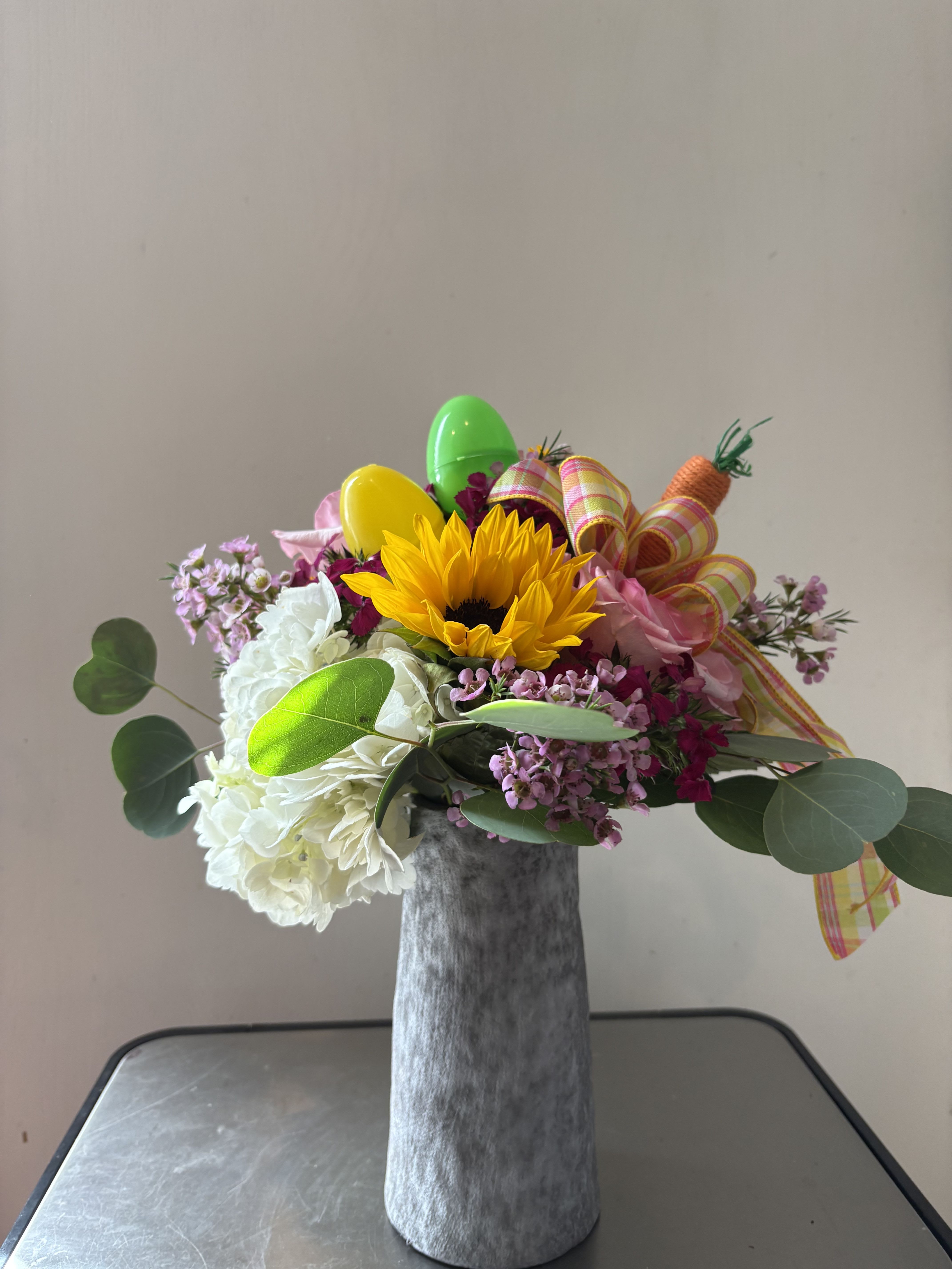 Hoppy Easter - Assorted spring flowers in a ceramic vase. 