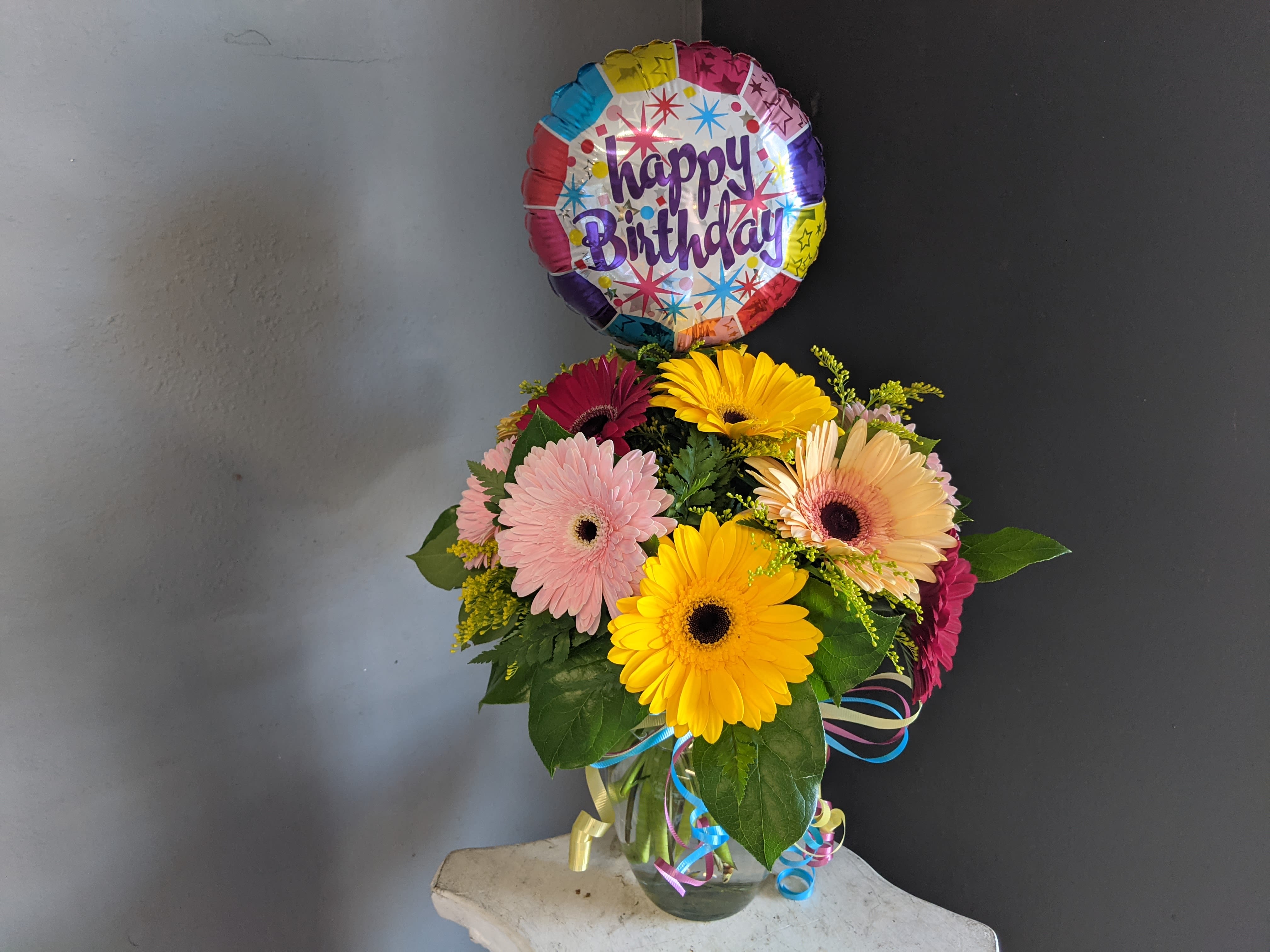 Dazzling Birthday Daisies  - A dozen Gerbera Daisy paired with fun birthday items. 