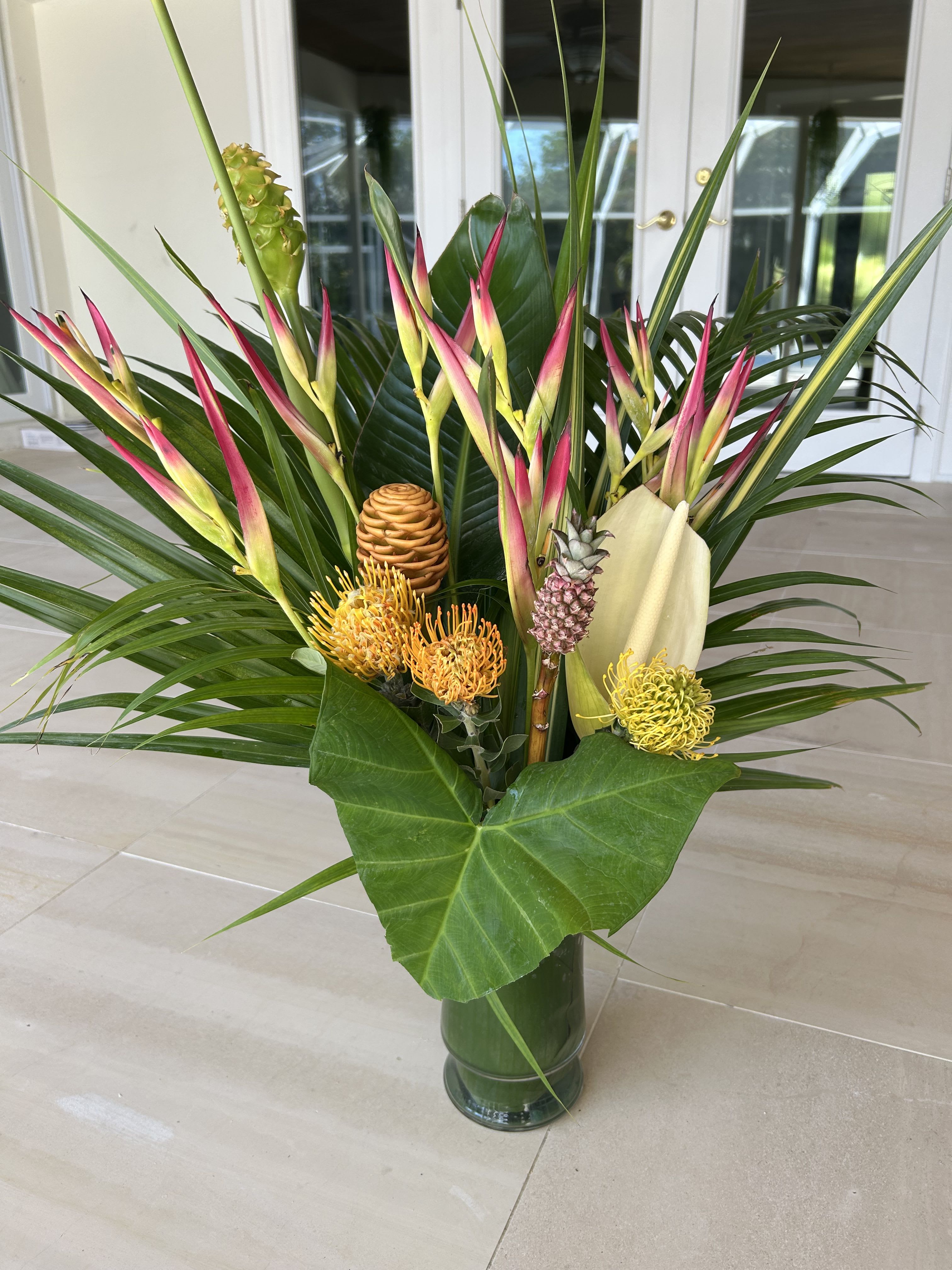 Tropical Splash - Splashing tropical display, Bold ad bright. Mix of tropical flowers and foliage.