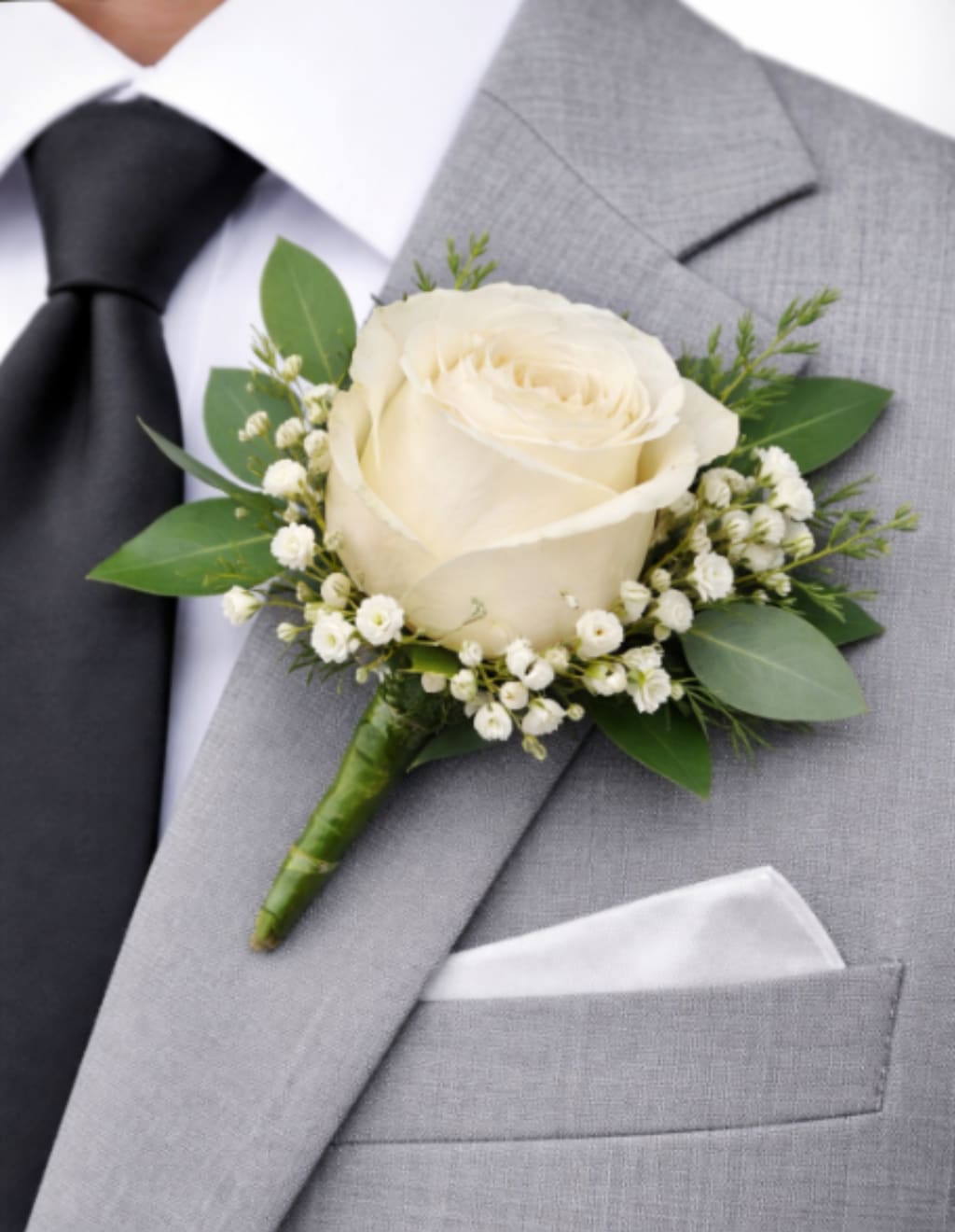 Boutonniere - Classic, refined, and thoughtfully designed, our boutonnieres are the perfect finishing touch for any special occasion. Each piece is handcrafted using fresh, high-quality blooms and accented with delicate greenery to complement your overall look. Designed for elegance and comfort, our boutonnieres are securely wrapped and styled to coordinate seamlessly with your florals, making them ideal for weddings, proms, and formal events.