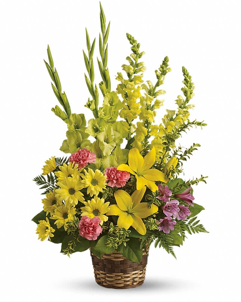 Tall yellow and pink flower basket with lilies, daisies, carnations, snapdragons, and alstroemeria.