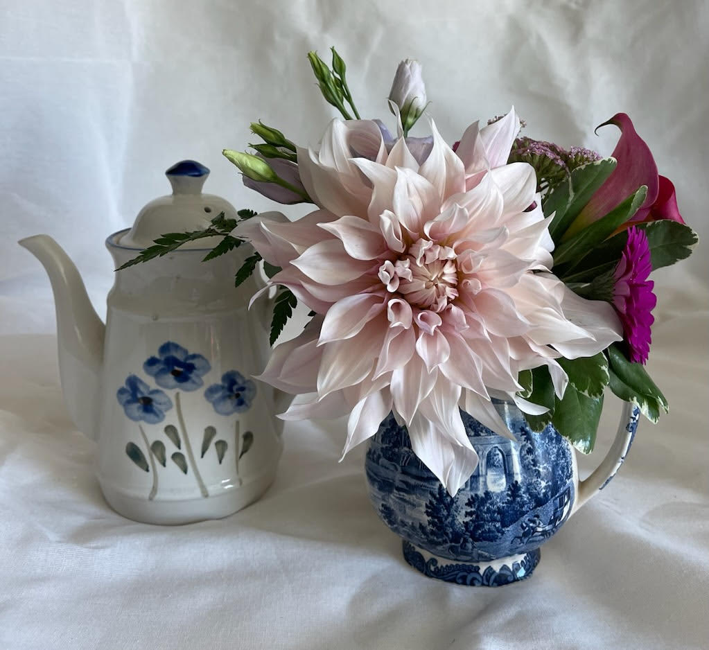 Fortnight - Each unique piece will be designed in a vintage vessel and feature in season blooms. A great gift for someone who loves antiques. "And for a fortnight there, we were forever"...using what is old and making it new again!
