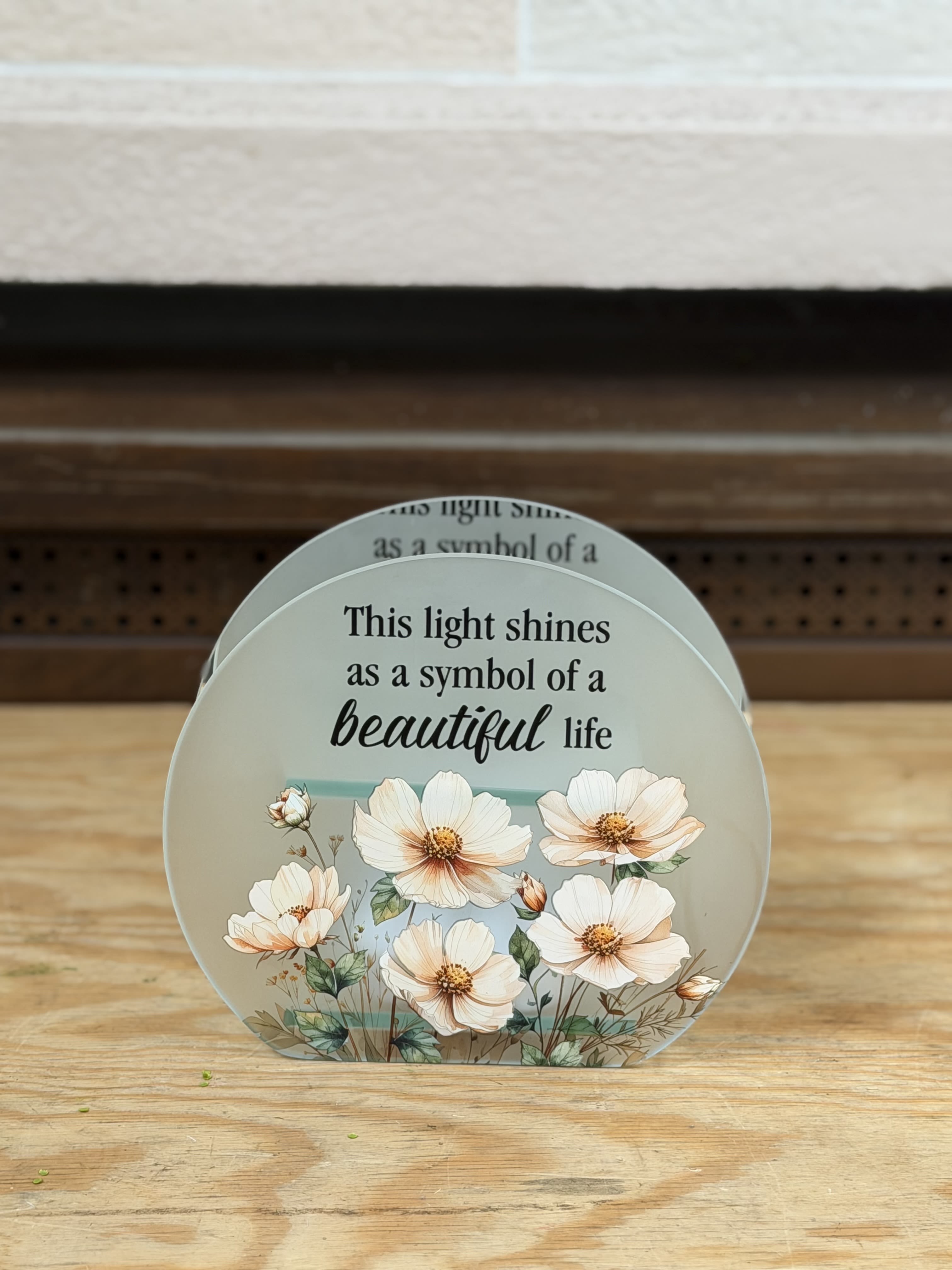 "Beautiful Life" Tealight Candle Holder  - A white flower tea light candle holder that reads "This light shines as a symbol of a beautiful life" 